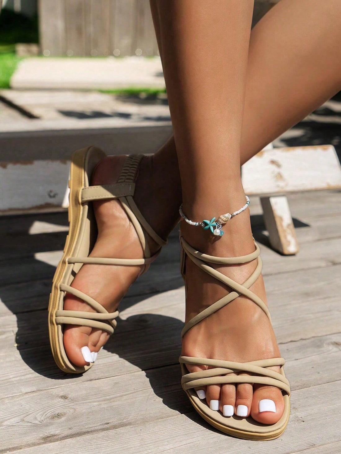 Women's khaki criss cross flat sandals with ankle strap and open toe design