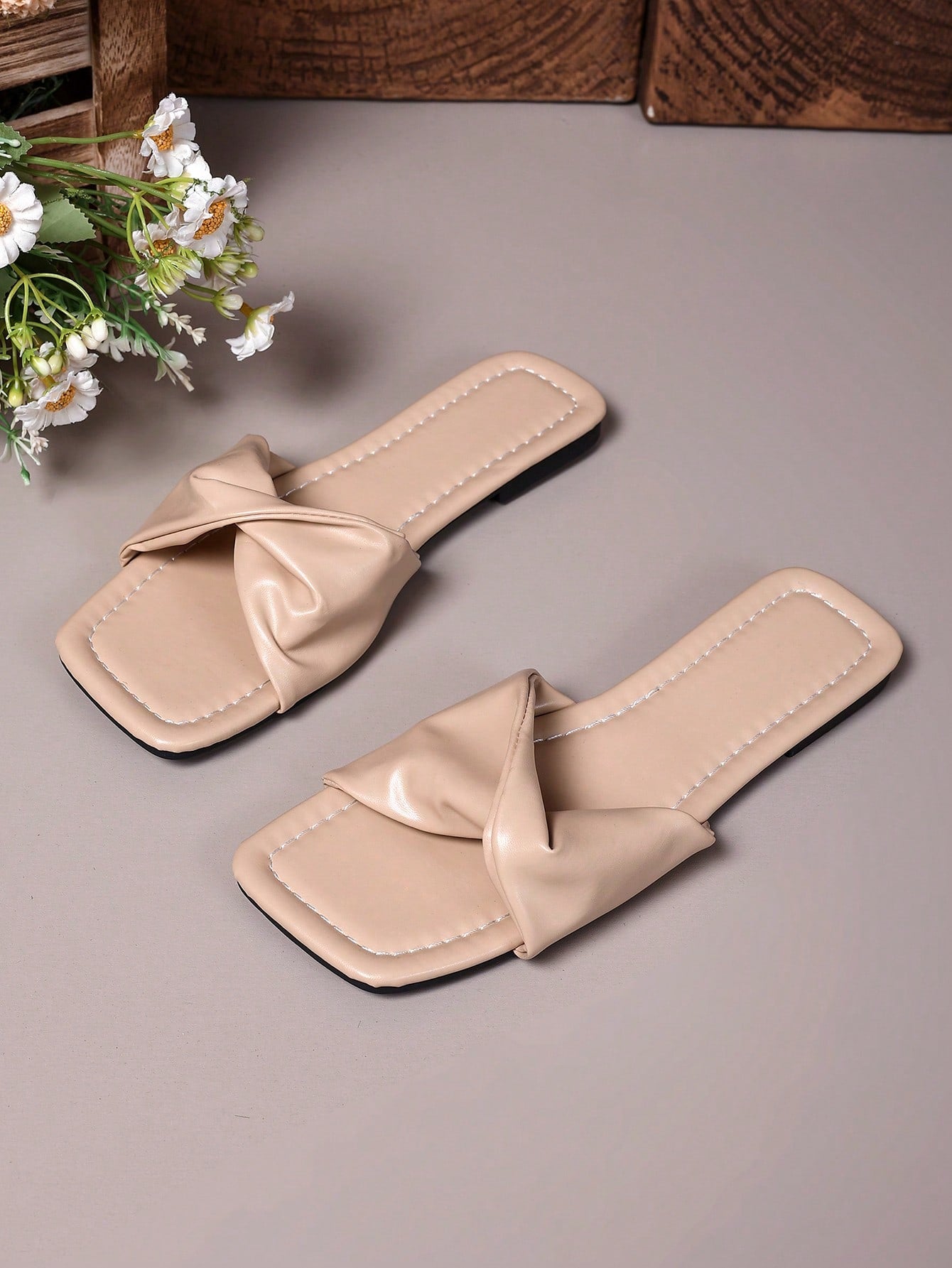 Women's white flat thong slide sandals with open square toe and twist detail, casual elegant style for home wear.