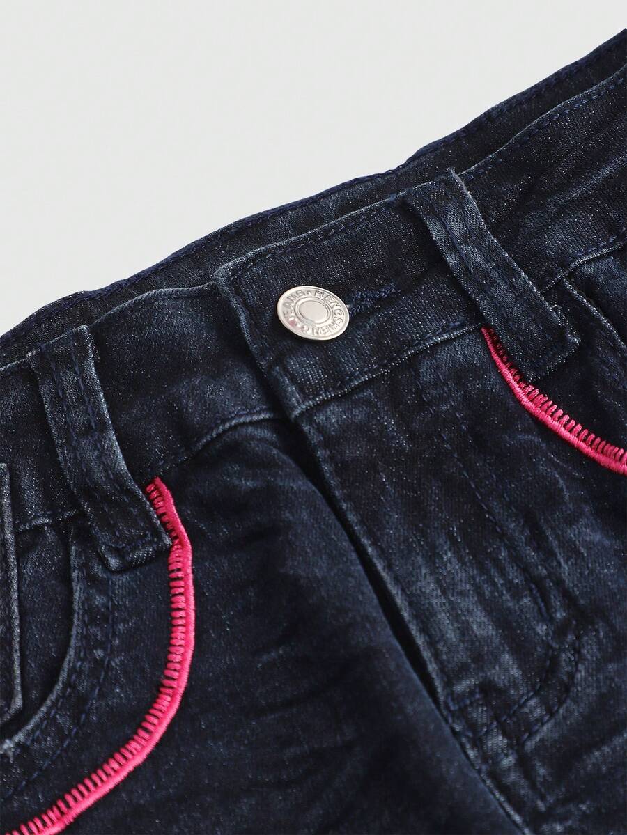 Blue Y2K low waist shorts with butterfly embroidery, distressed washed finish, raw hem, button detail, and zipper fly closure.