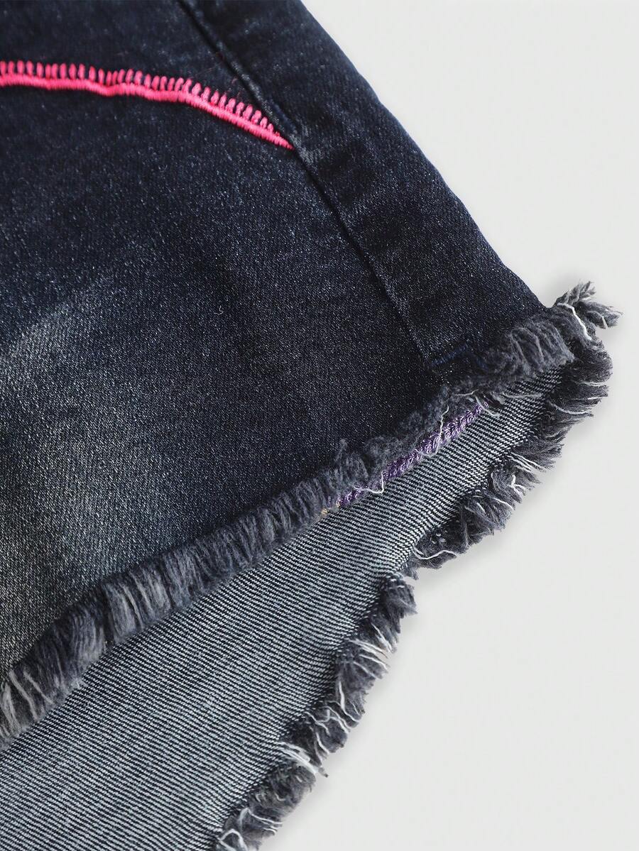 Blue Y2K low waist shorts with butterfly embroidery, distressed washed finish, raw hem, button detail, and zipper fly closure.