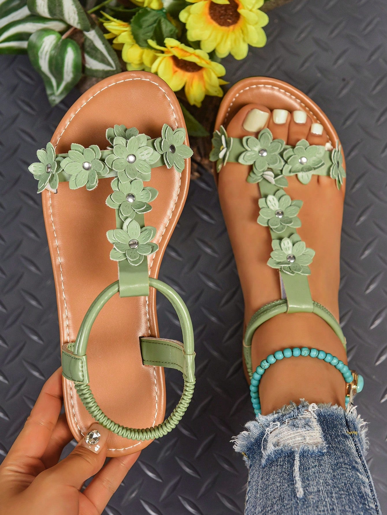 Women's bohemian flat slide sandals with embroidered applique detailing and open-toe design, suitable for casual beach and vacation wear.