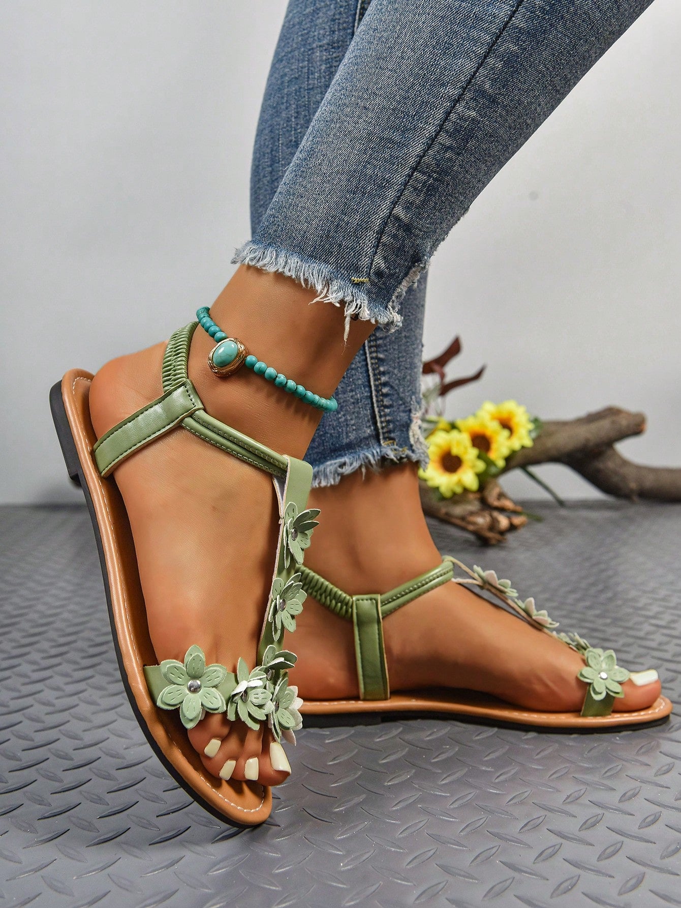 Women's bohemian flat slide sandals with embroidered applique detailing and open-toe design, suitable for casual beach and vacation wear.