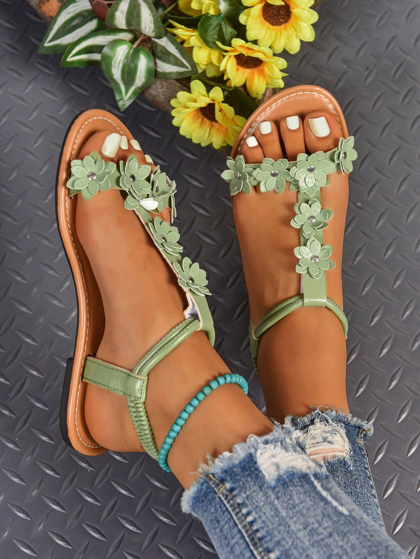 Women's bohemian flat slide sandals with embroidered applique detailing and open-toe design, suitable for casual beach and vacation wear.