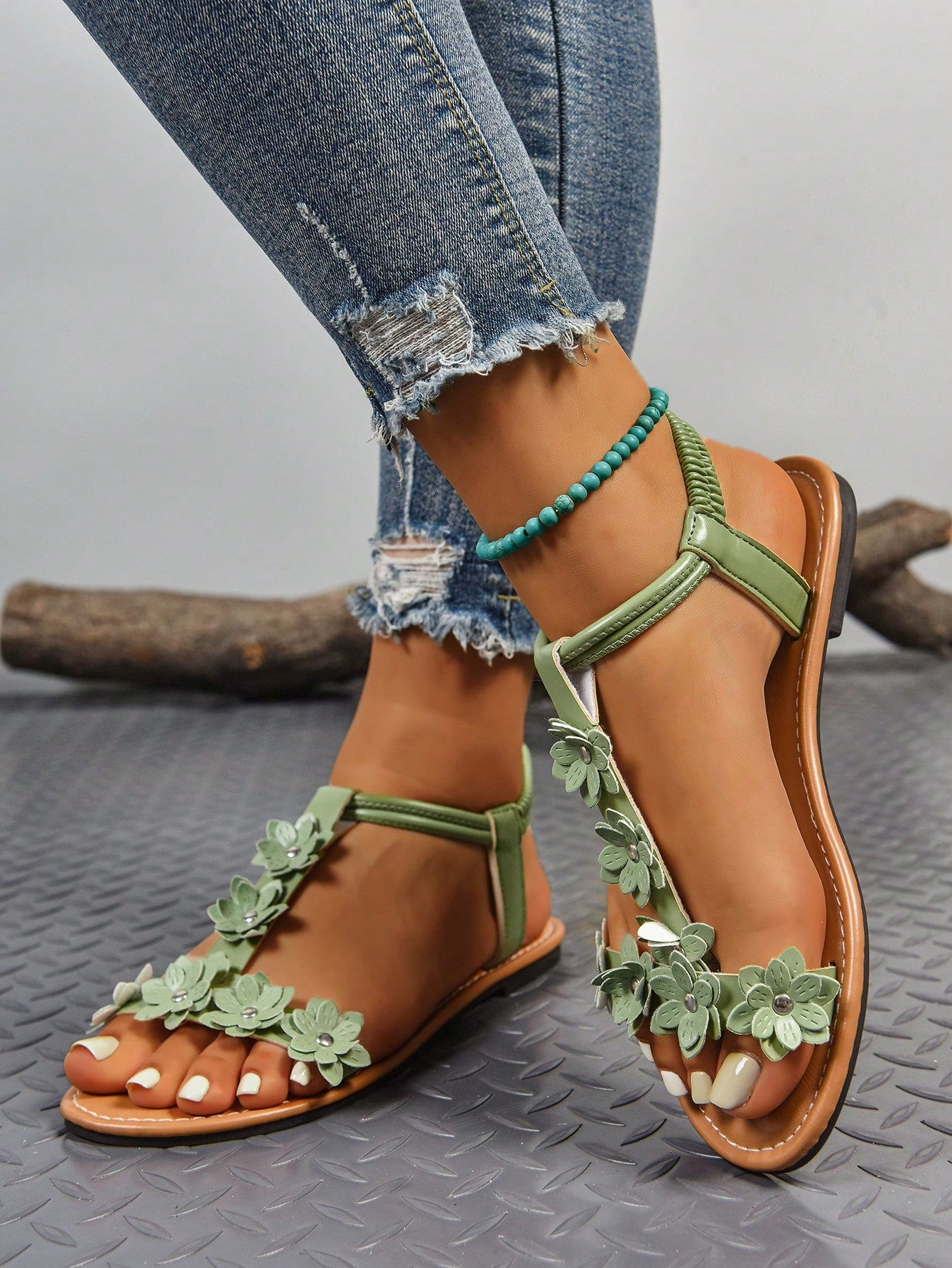 Women's bohemian flat slide sandals with embroidered applique detailing and open-toe design, suitable for casual beach and vacation wear.