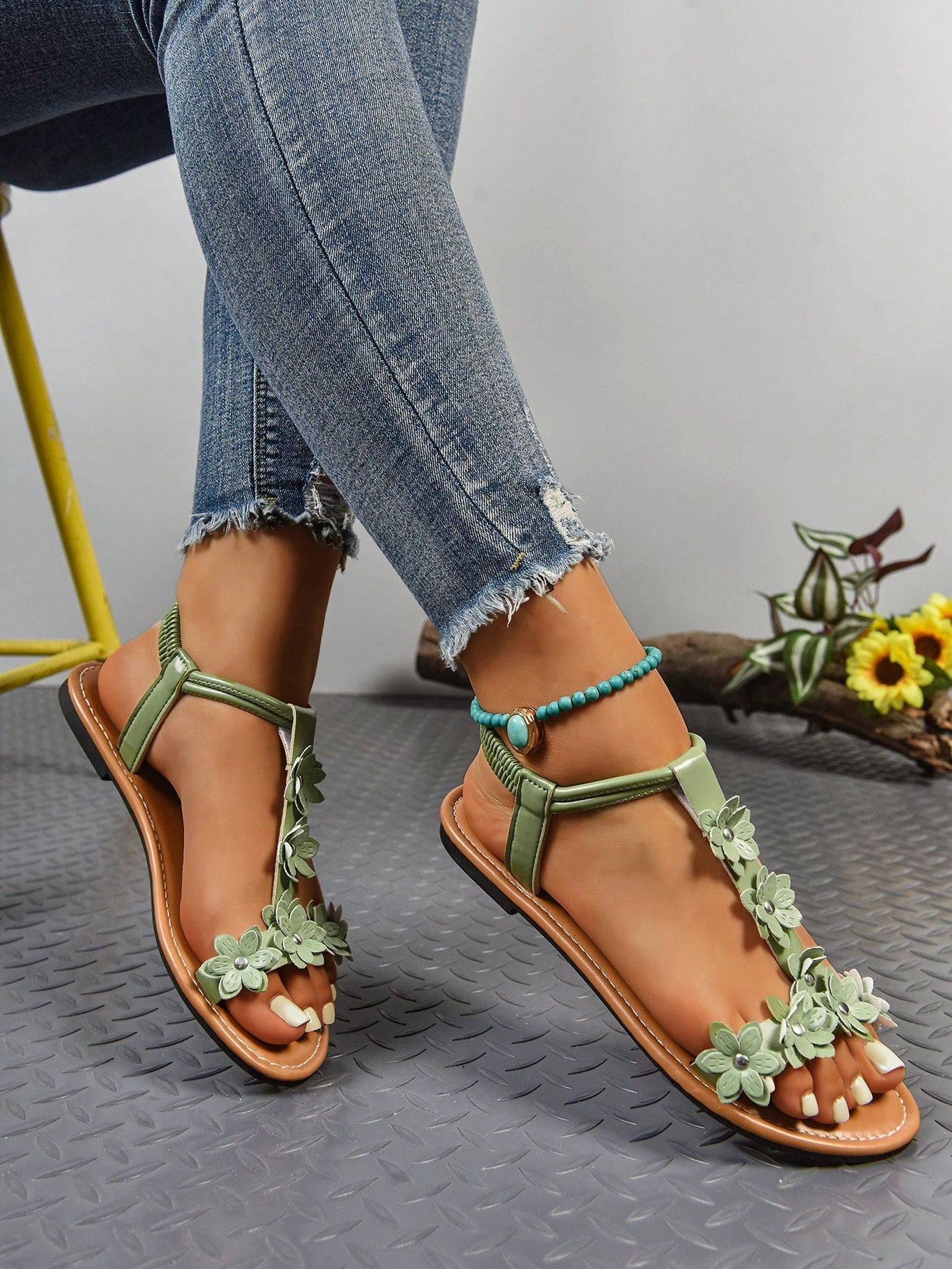 Women's bohemian flat slide sandals with embroidered applique detailing and open-toe design, suitable for casual beach and vacation wear.