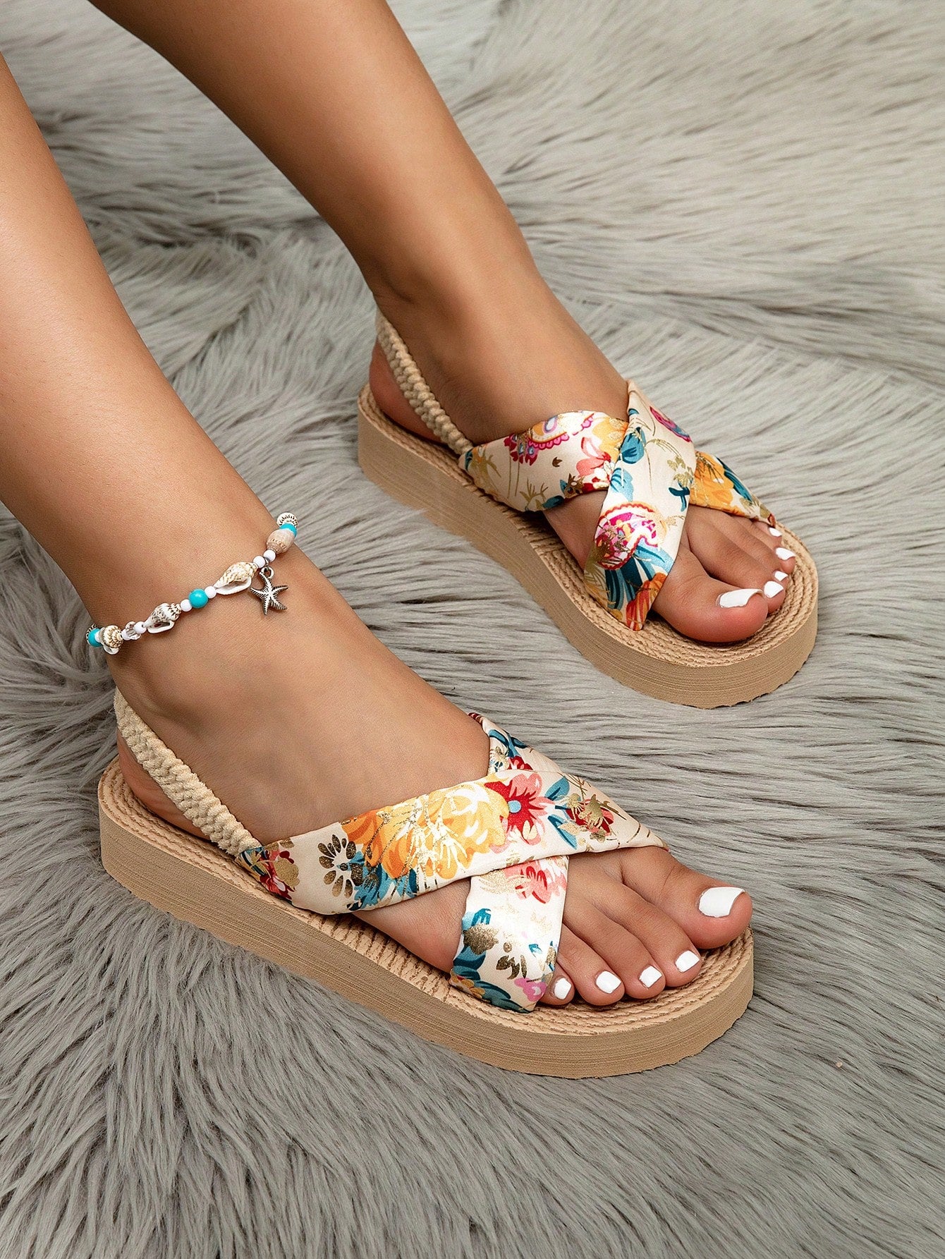 Women's open toe slip-on wedge sandals with criss cross straps and folk-custom styling, featuring raw hem, fringe, tassel, braid, and tape details.