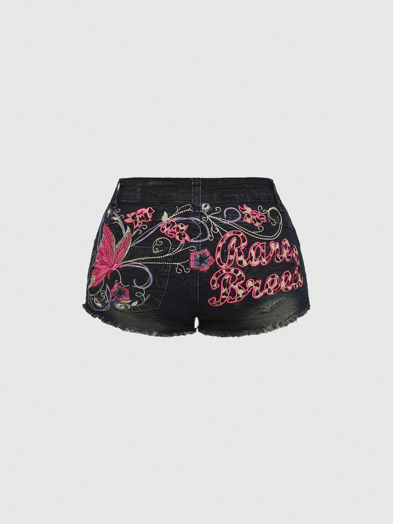 Blue Y2K low waist shorts with butterfly embroidery, distressed washed finish, raw hem, button detail, and zipper fly closure.