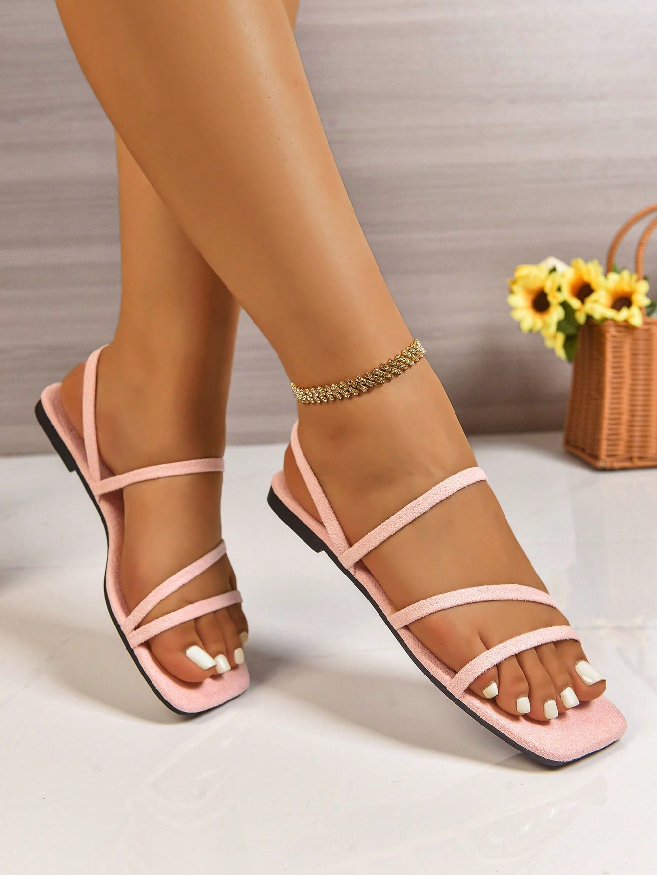 Women's flat sandals with a square open toe, crisscross front straps, and an elastic ankle strap, suitable for casual summer outdoor and beach vacation wear.
