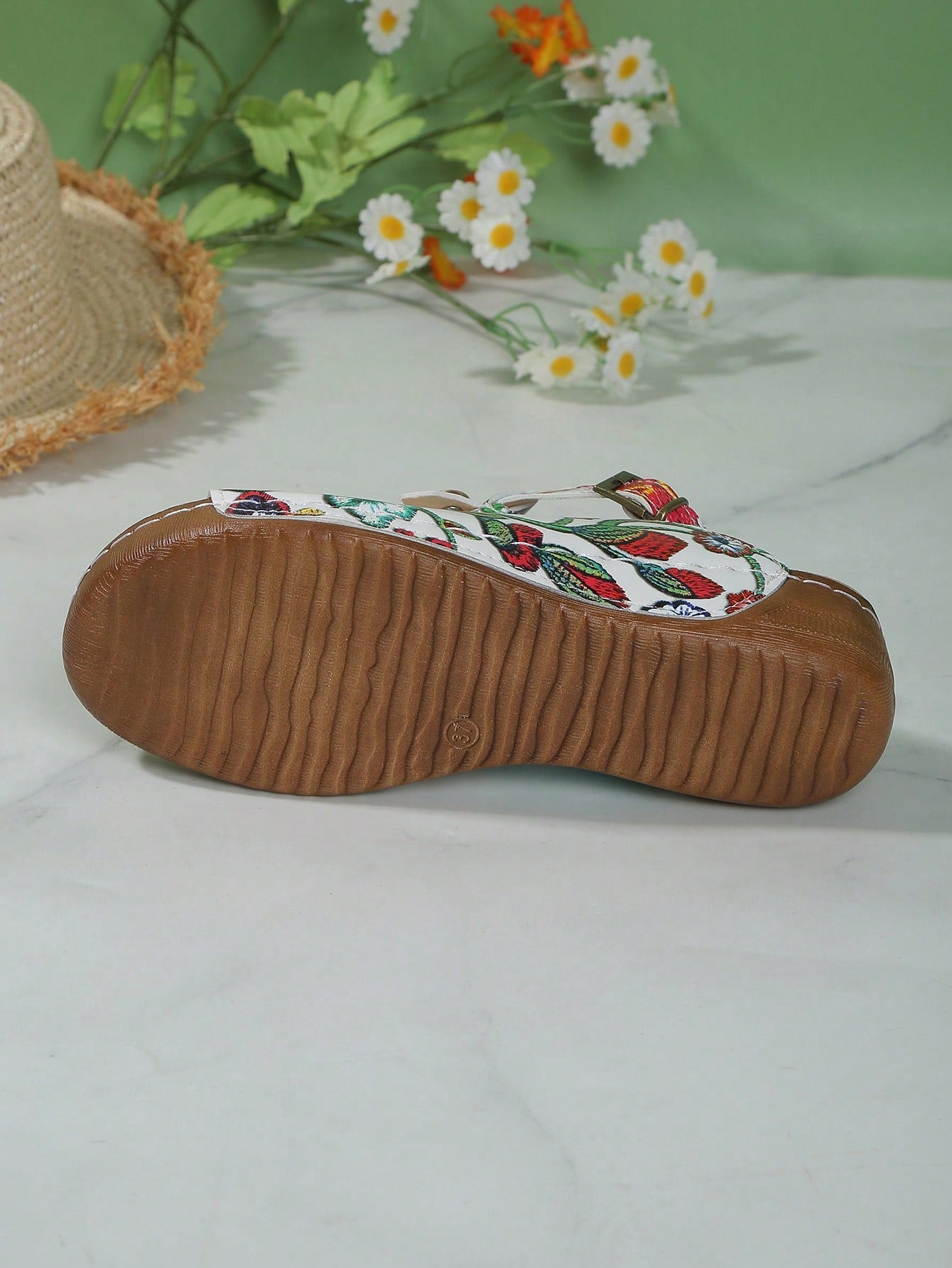 Women's open-toe platform wedge beach sandals with thick sole, stitching detail, floral accents, buckle closure, and removable adjustable shoelaces.