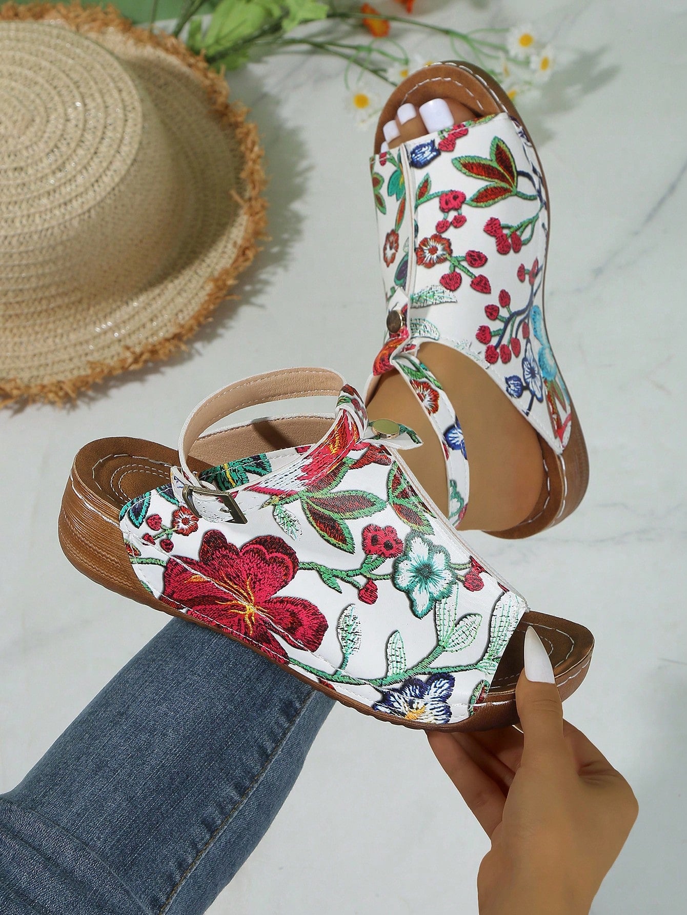 Women's open-toe platform wedge beach sandals with thick sole, stitching detail, floral accents, buckle closure, and removable adjustable shoelaces.