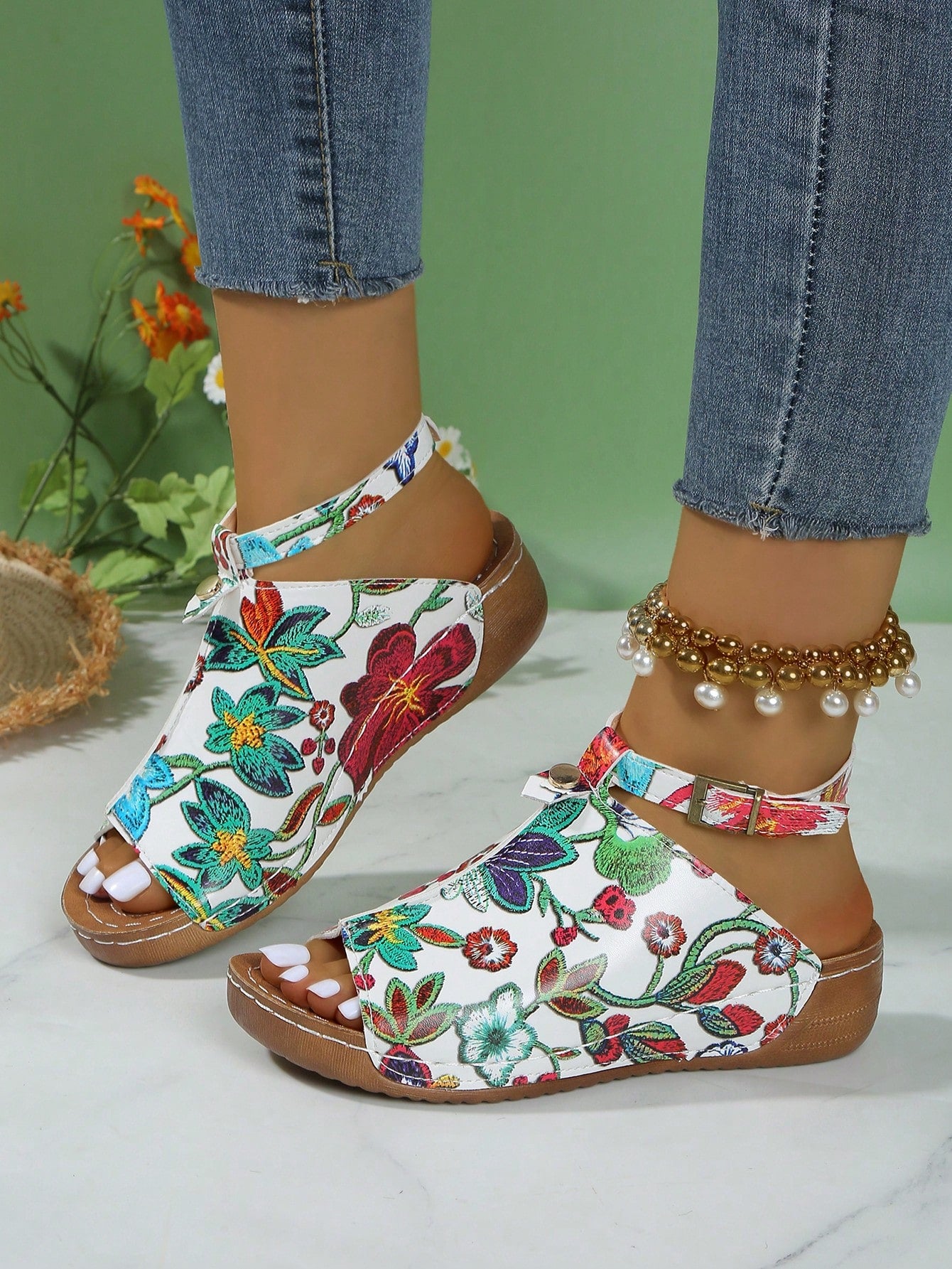 Women's open-toe platform wedge beach sandals with thick sole, stitching detail, floral accents, buckle closure, and removable adjustable shoelaces.