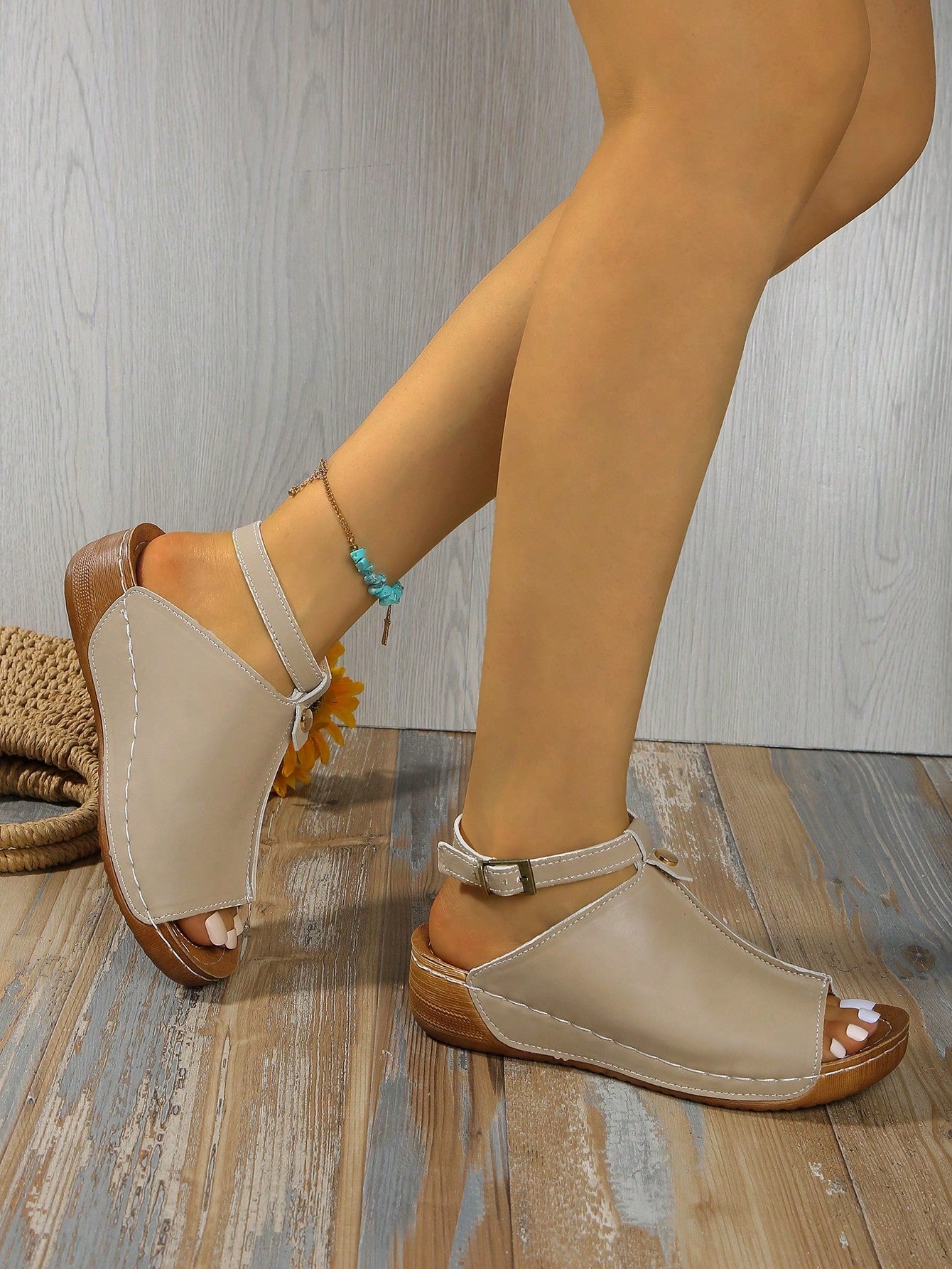 Women's open-toe platform wedge beach sandals with thick sole, stitching detail, floral accents, buckle closure, and removable adjustable shoelaces.