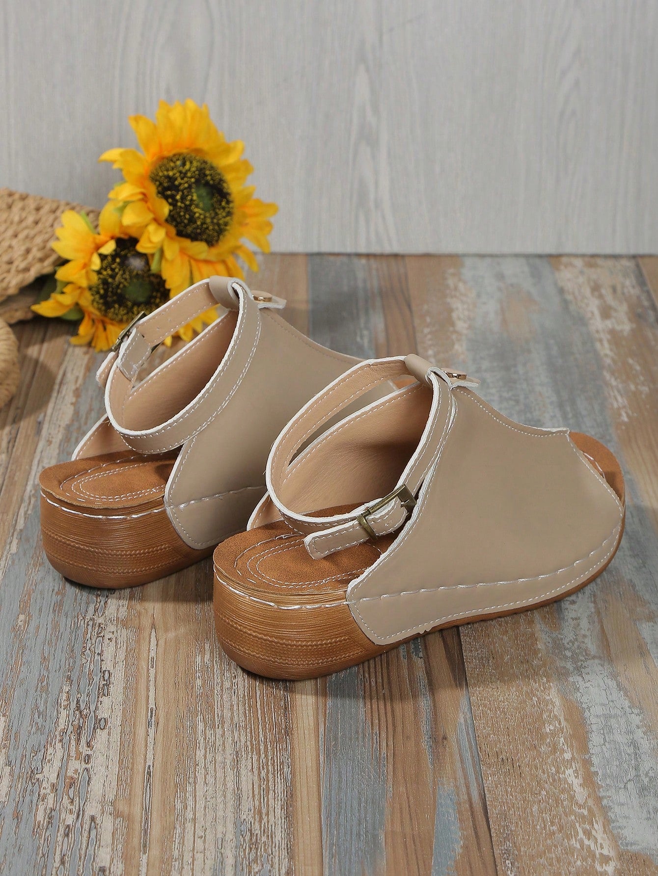 Women's open-toe platform wedge beach sandals with thick sole, stitching detail, floral accents, buckle closure, and removable adjustable shoelaces.