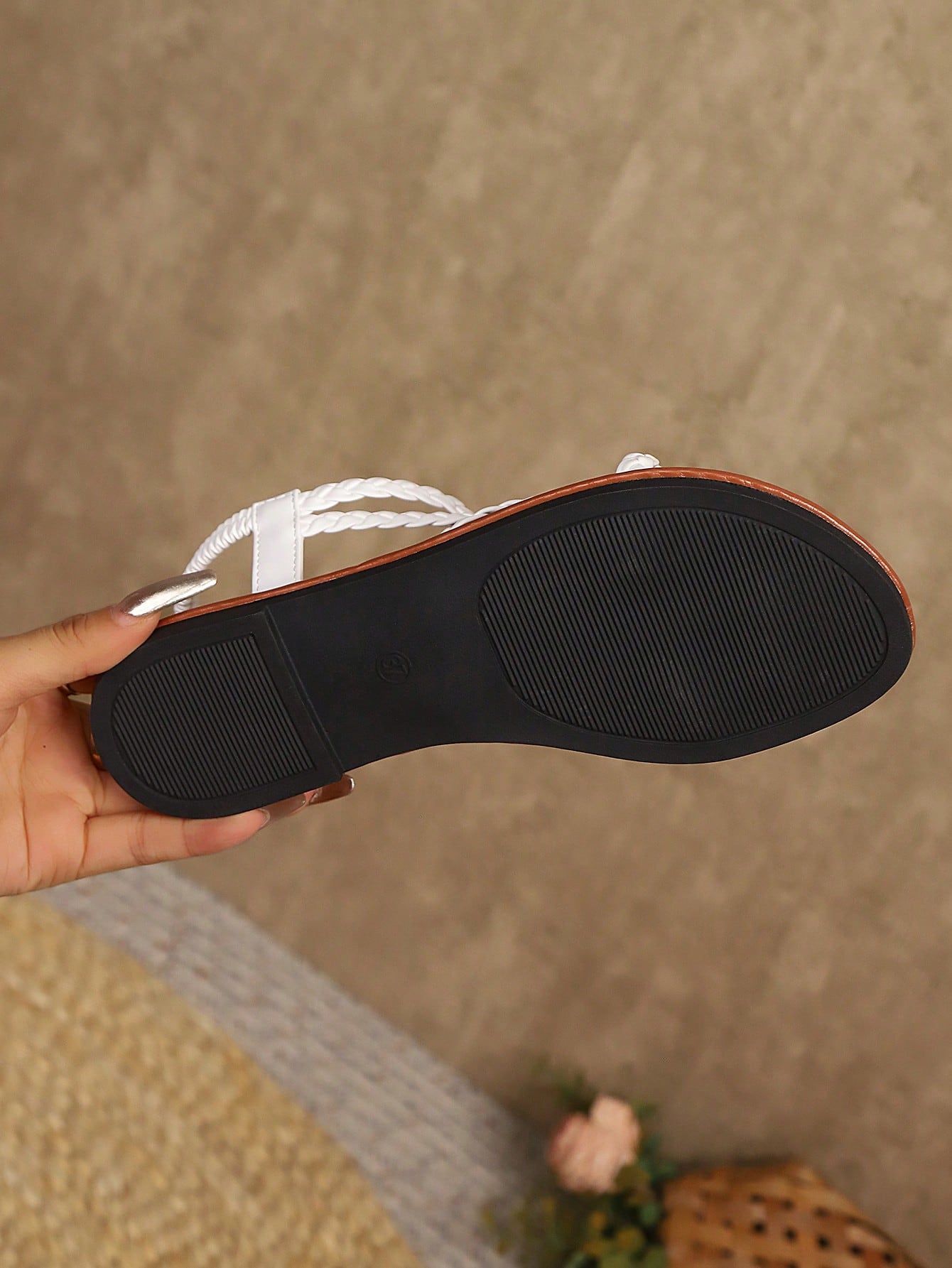 Open-toe flat slide sandals featuring rhinestone leaf decoration in a vacation-inspired style.