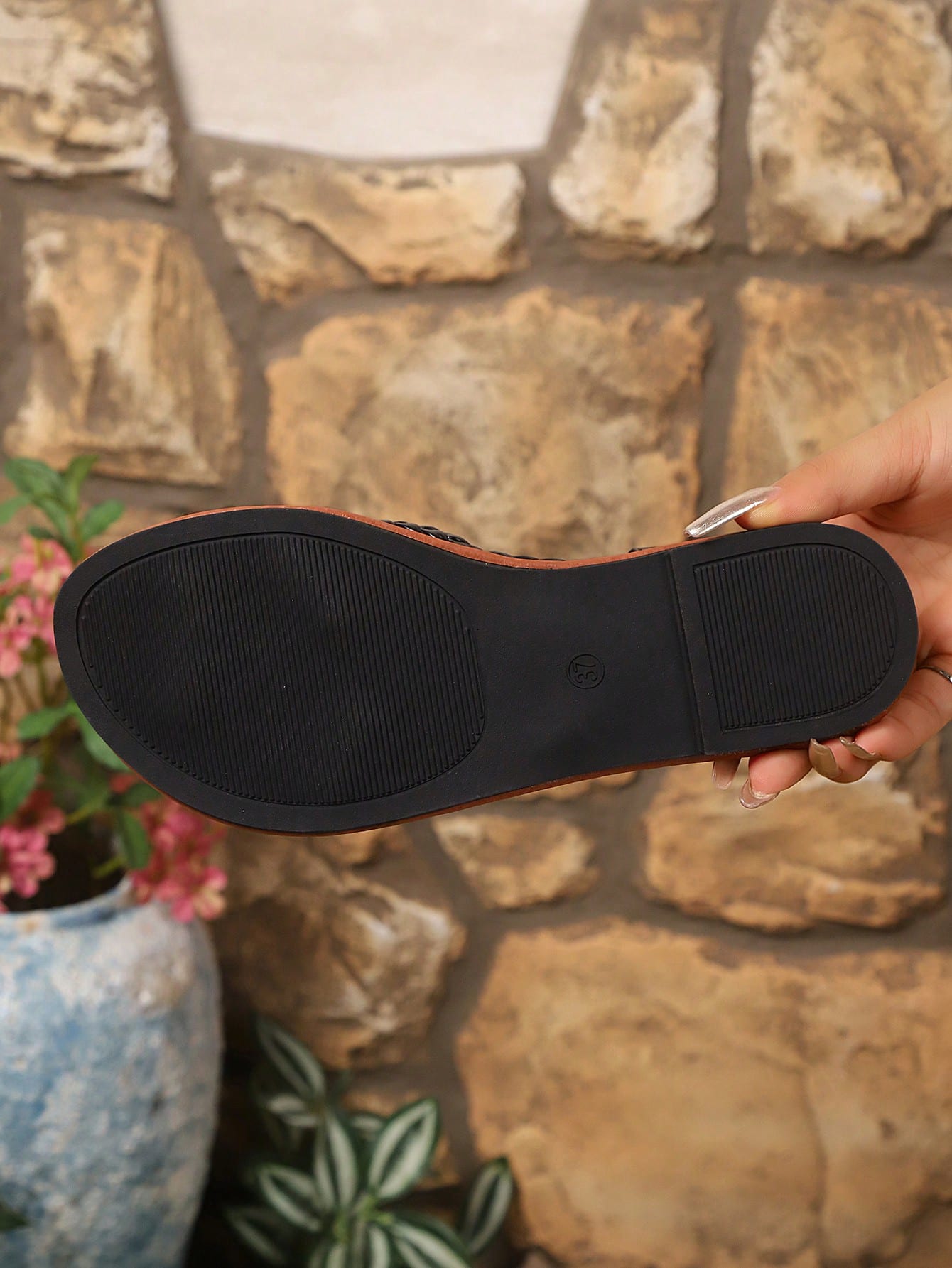 Open-toe flat slide sandals featuring rhinestone leaf decoration in a vacation-inspired style.