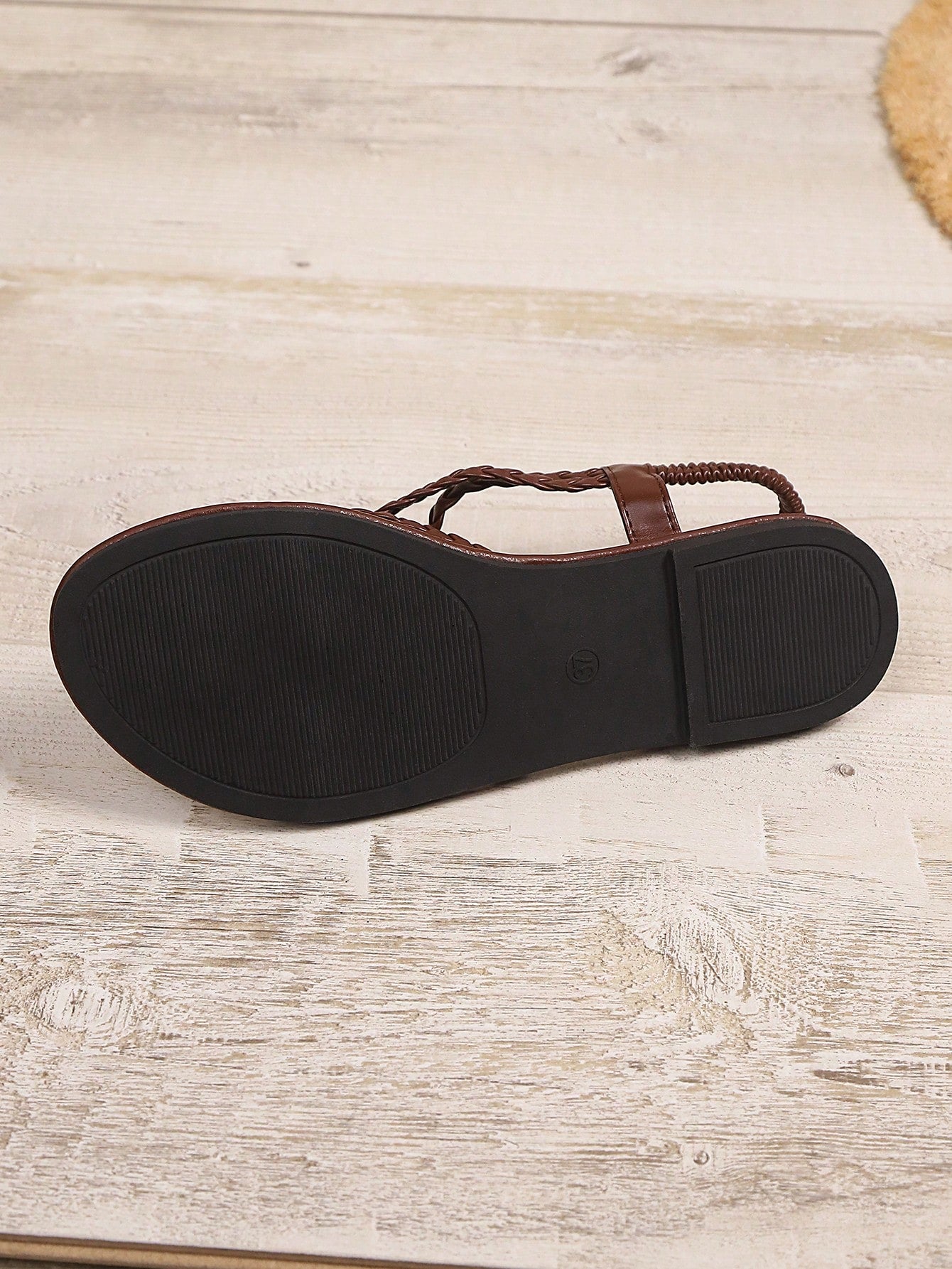 Open-toe flat slide sandals featuring rhinestone leaf decoration in a vacation-inspired style.