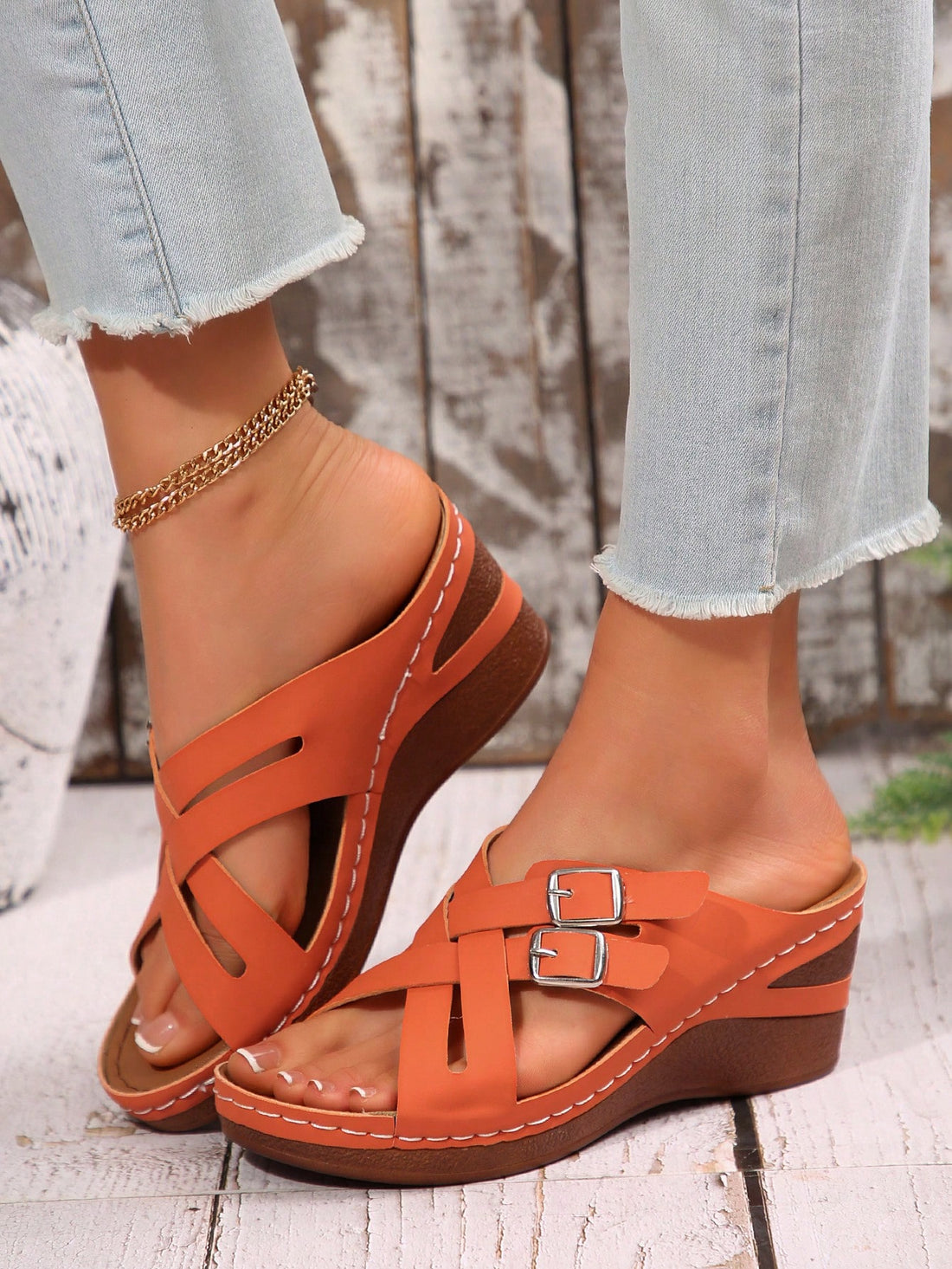 Women's orange platform wedge sandals with an open toe, plain design, and buckle detail, suitable for casual outdoor and beach wear.