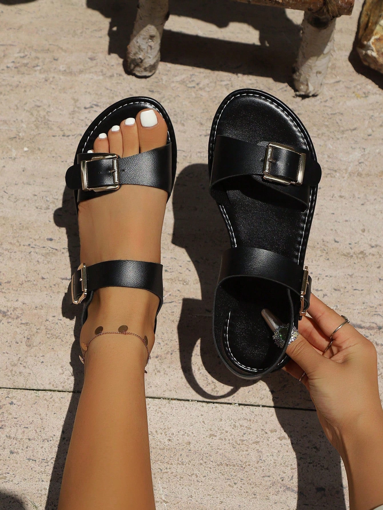 Women’s flat gladiator slide sandals with criss-cross multi straps, adjustable buckle detail, open toe design, and non-slip sole for casual beach and everyday wear.