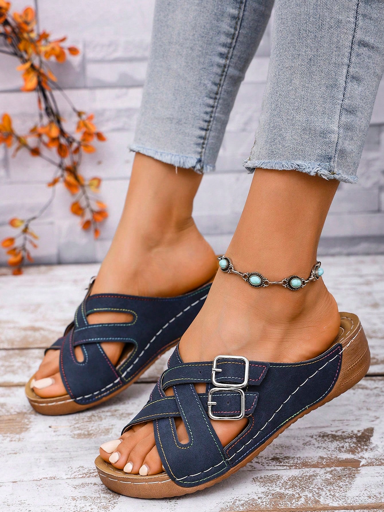 Women's slip-on beach wedge slide sandals with open toe, thick sole, criss-cross straps, and buckle detail