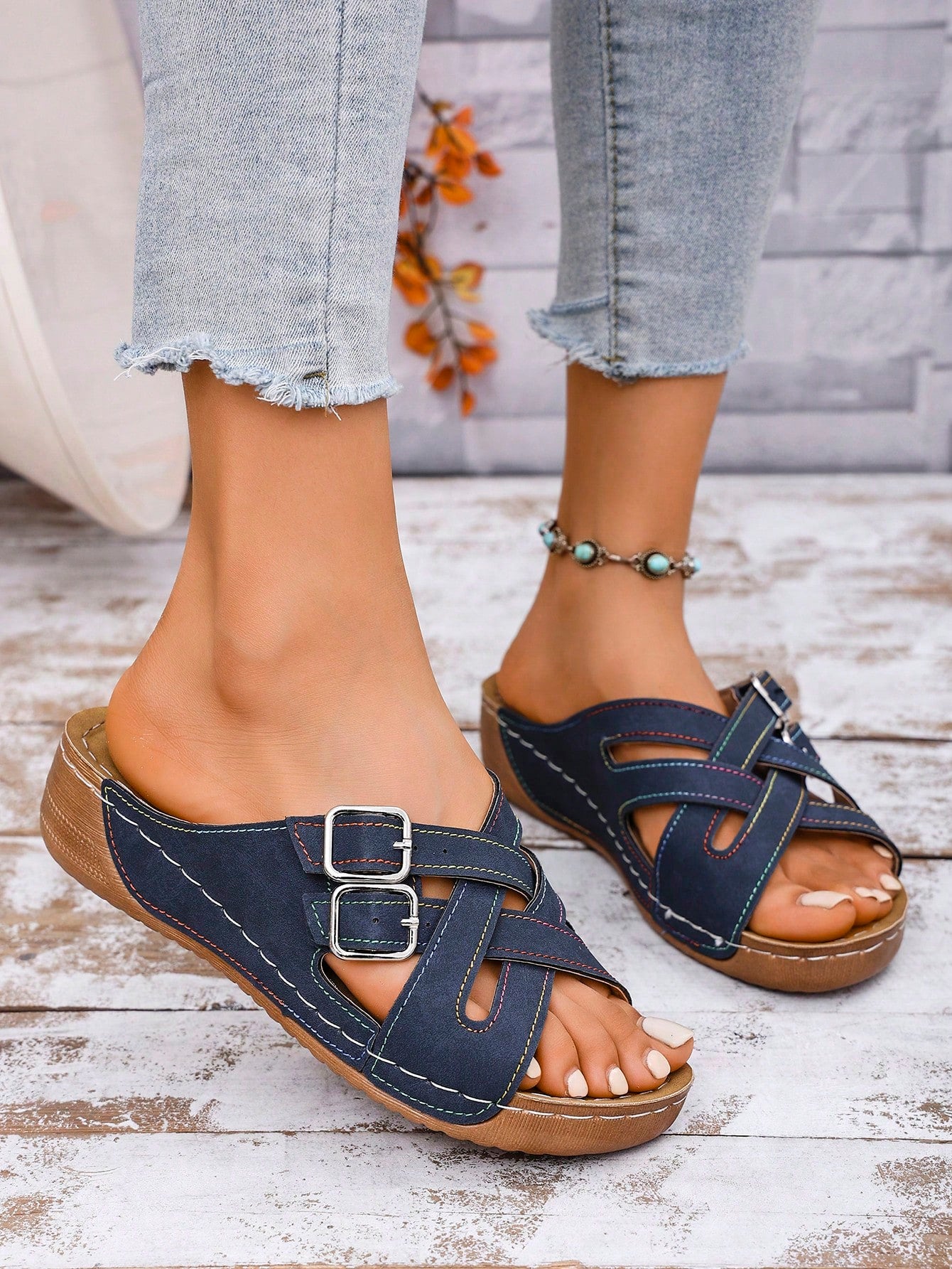 Women's slip-on beach wedge slide sandals with open toe, thick sole, criss-cross straps, and buckle detail