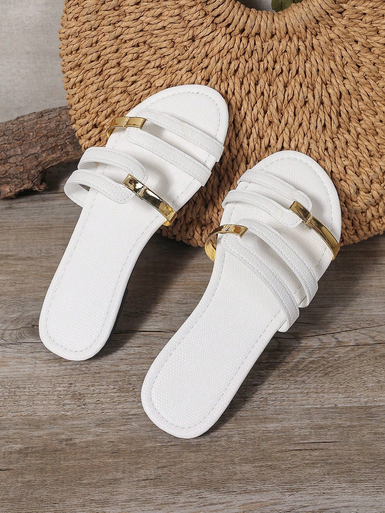 Women's yellow open-toe flat slide sandals featuring a cut-out design and textured plain pattern for casual beach and daily wear.