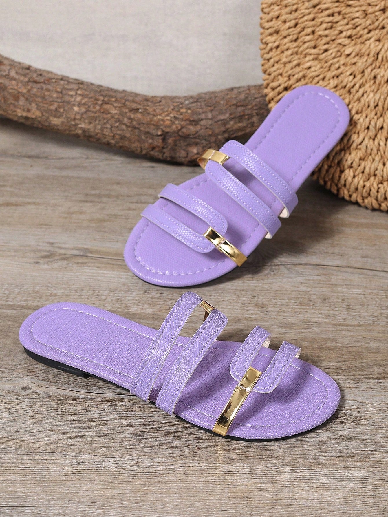 Women's yellow open-toe flat slide sandals featuring a cut-out design and textured plain pattern for casual beach and daily wear.