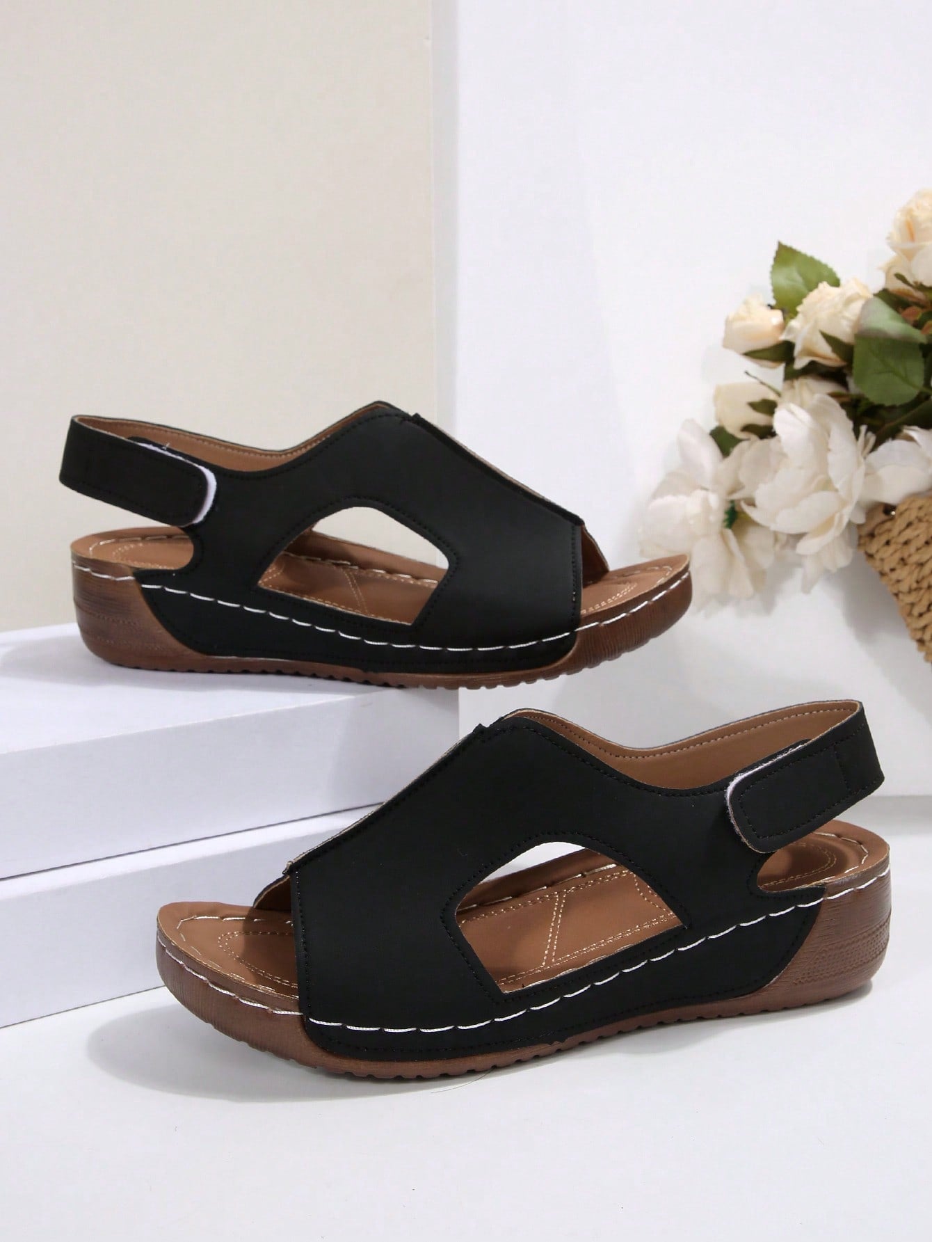 Women's color block platform flat sandals with open toe, criss-cross straps, and hook-loop closure, featuring a low heel thick sole design for casual vacation wear.