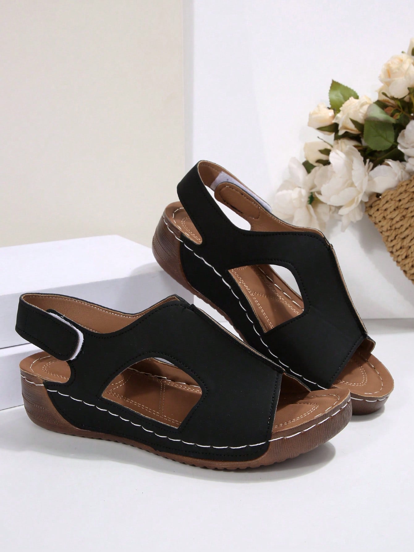 Women's color block platform flat sandals with open toe, criss-cross straps, and hook-loop closure, featuring a low heel thick sole design for casual vacation wear.
