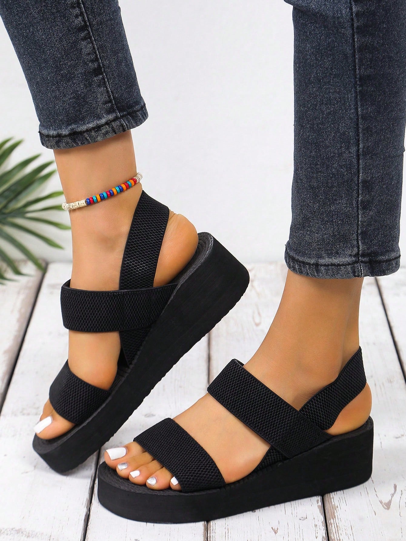 Women's open toe wedge slide sandals with a thick platform-style sole and mid heel, slip-on design for beach and outdoor summer use.