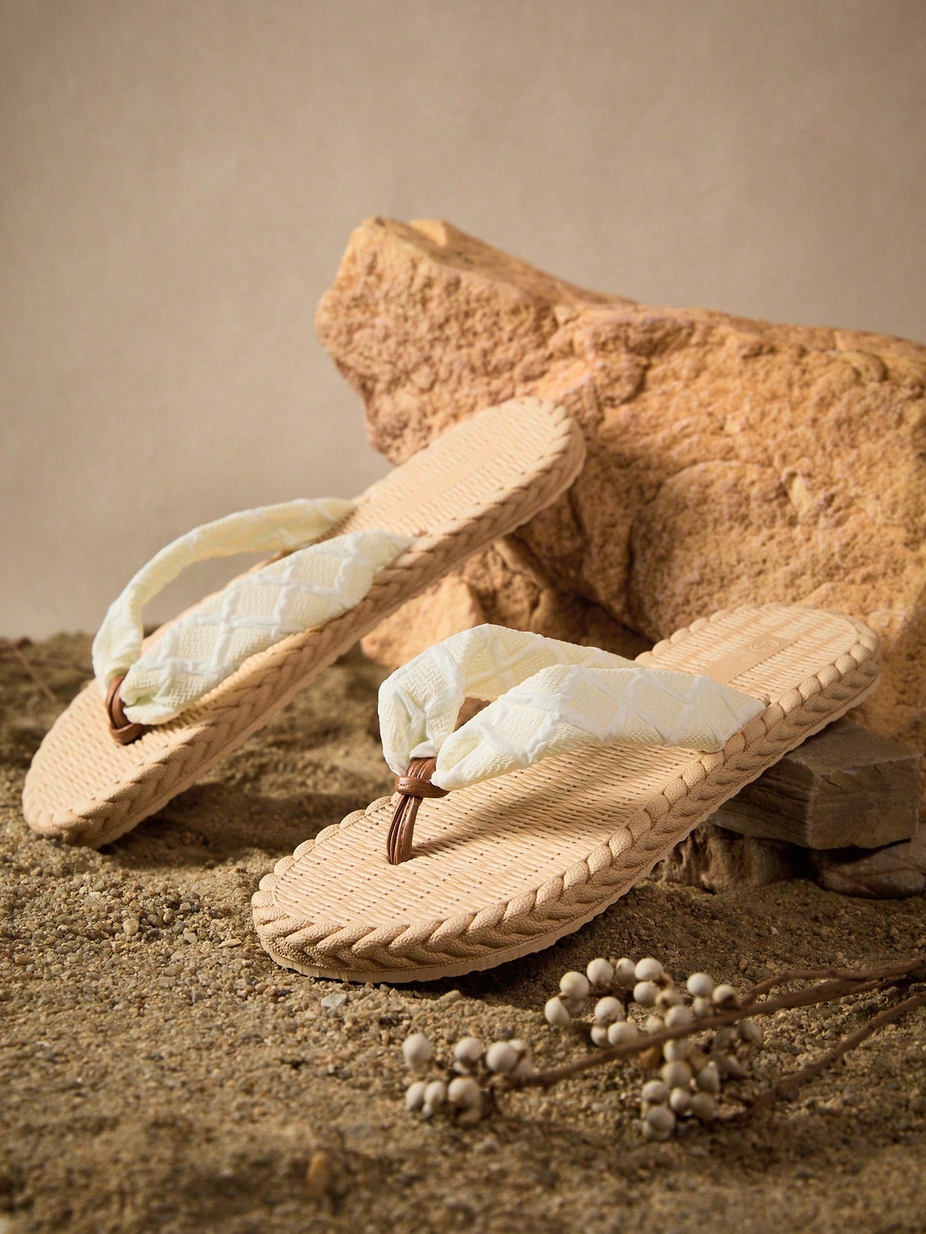 White women's flat sandals with cloud-inspired colorblock and tropical pattern, featuring braided woven-look straps and a casual beach style.