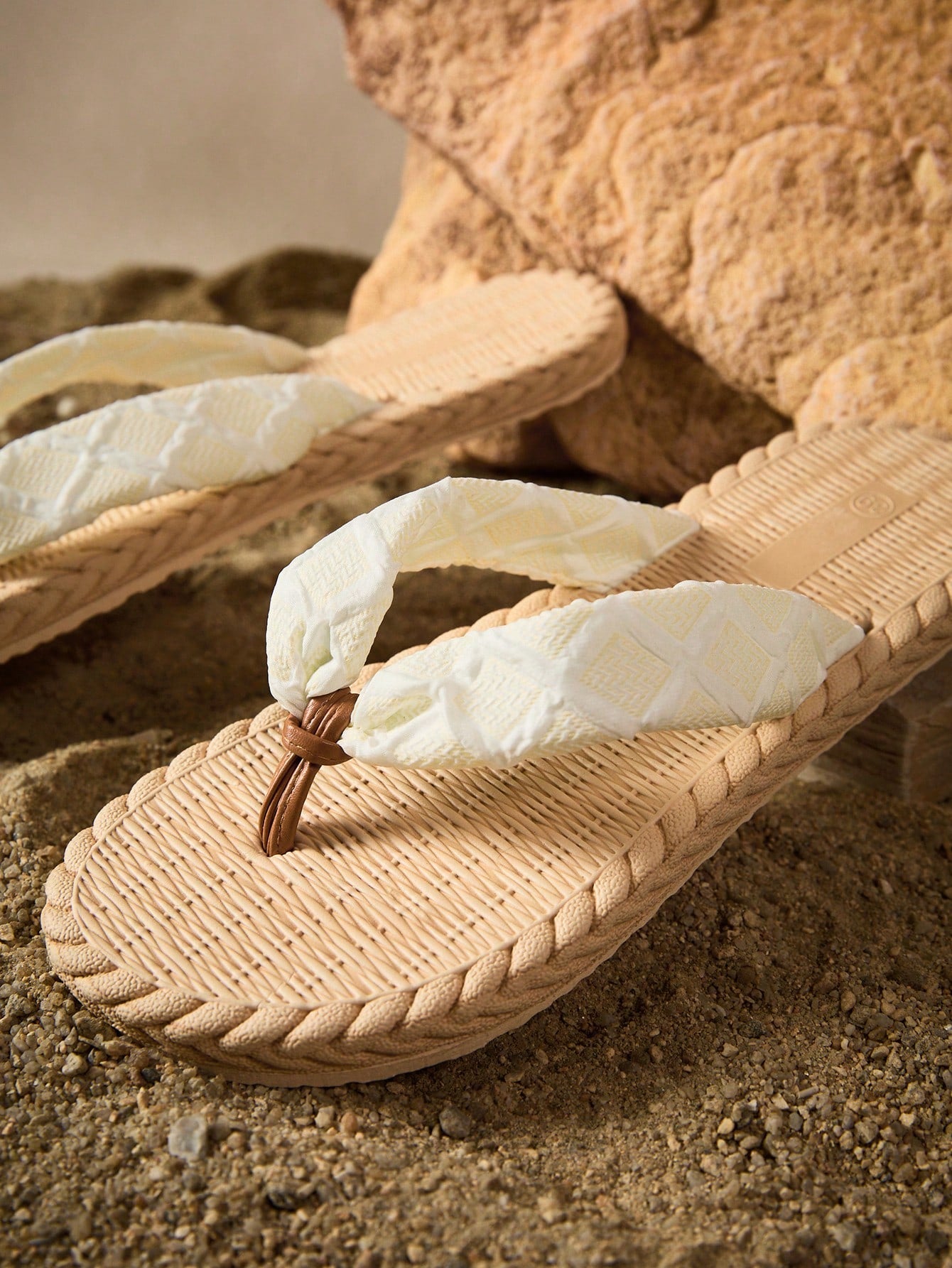 White women's flat sandals with cloud-inspired colorblock and tropical pattern, featuring braided woven-look straps and a casual beach style.