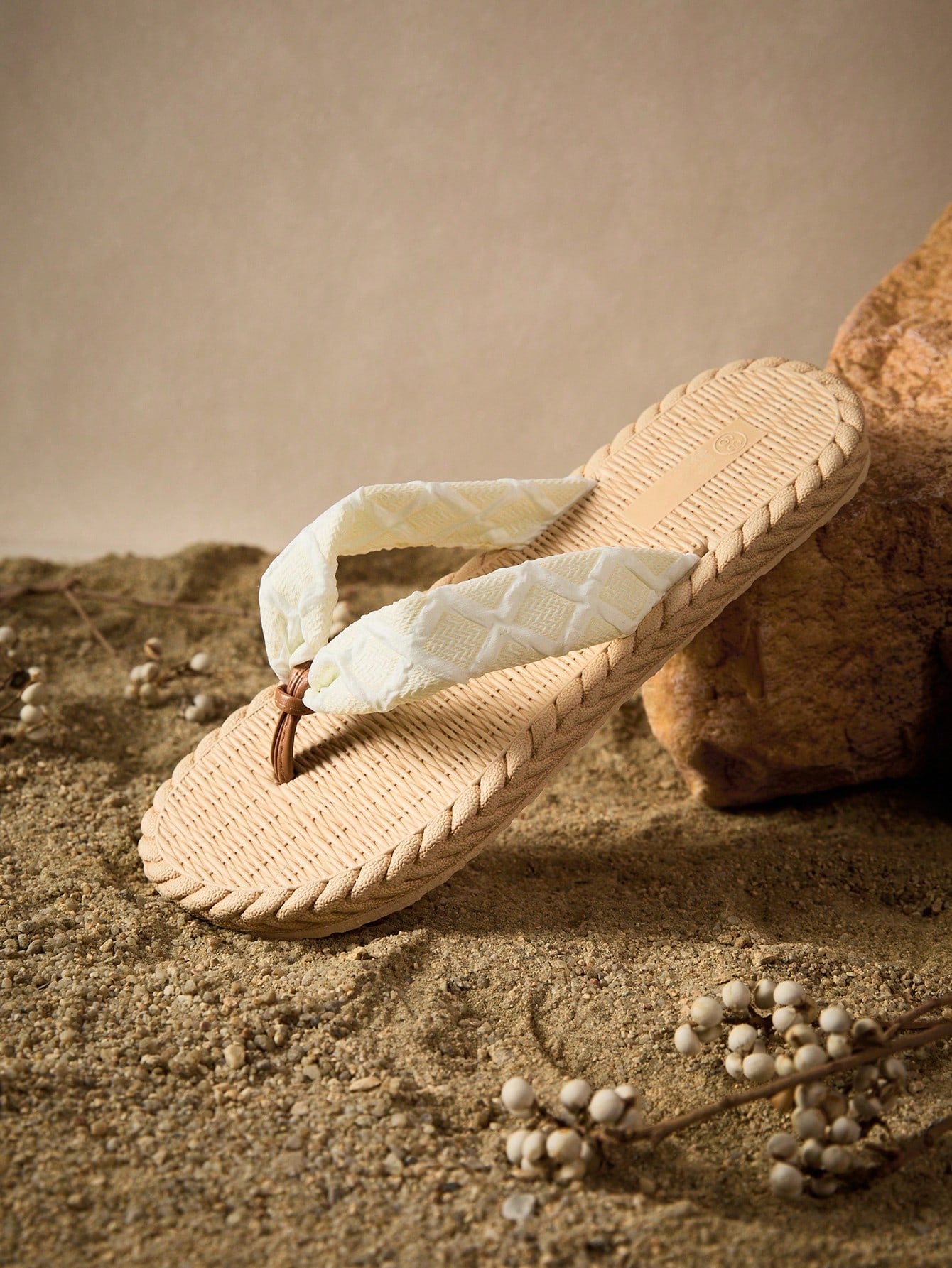 White women's flat sandals with cloud-inspired colorblock and tropical pattern, featuring braided woven-look straps and a casual beach style.