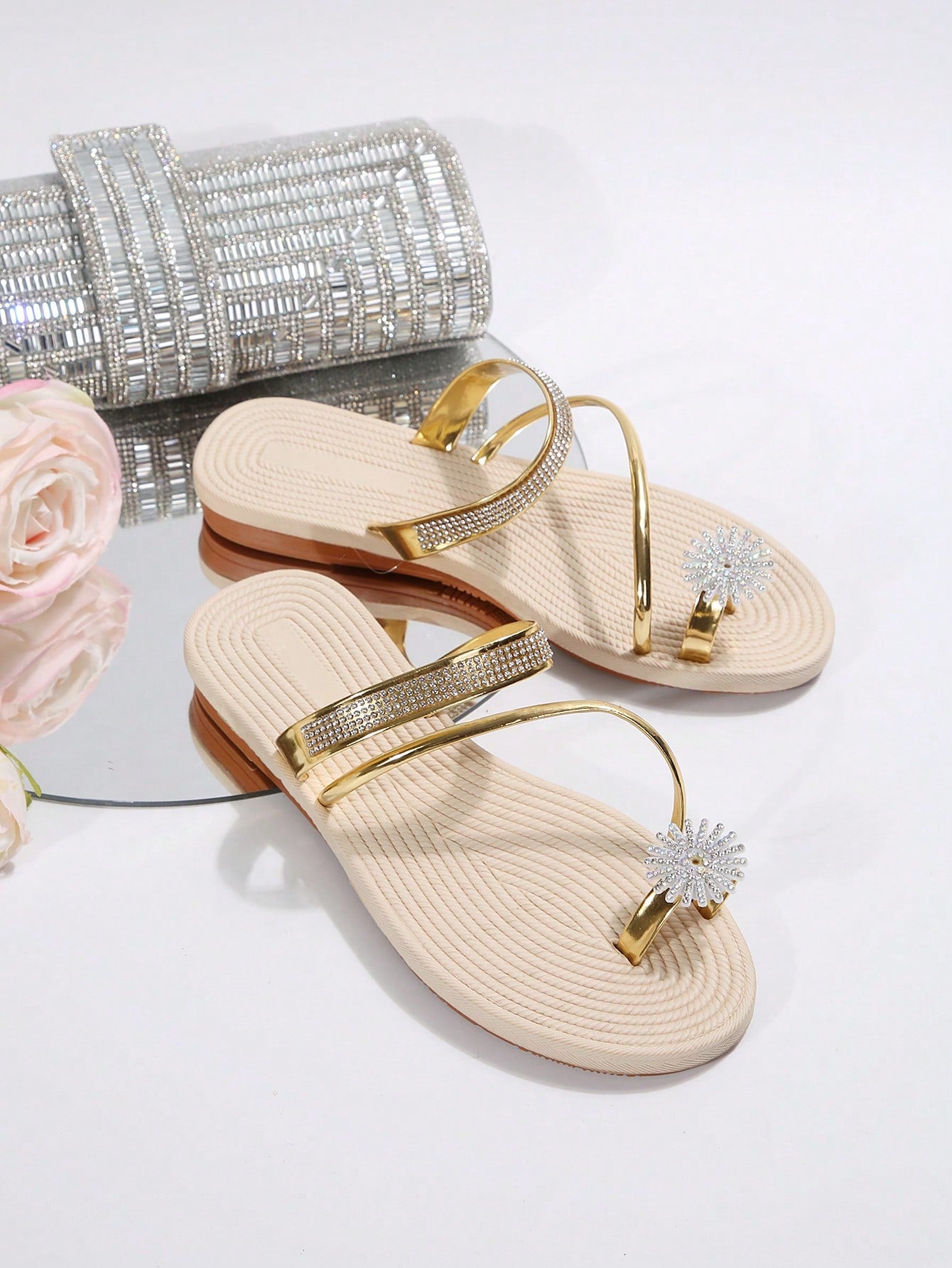 Women's casual flat sandals with slip-on criss-cross straps, toe post design, and rhinestone detail, suitable for beach and summer vacation wear.