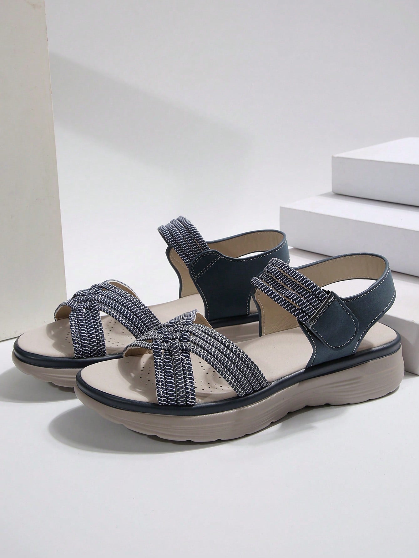 Women's plus size platform wedge sandals with hook-and-loop closure, open toe, ankle strap, and cut-out detailing in a casual beach style.