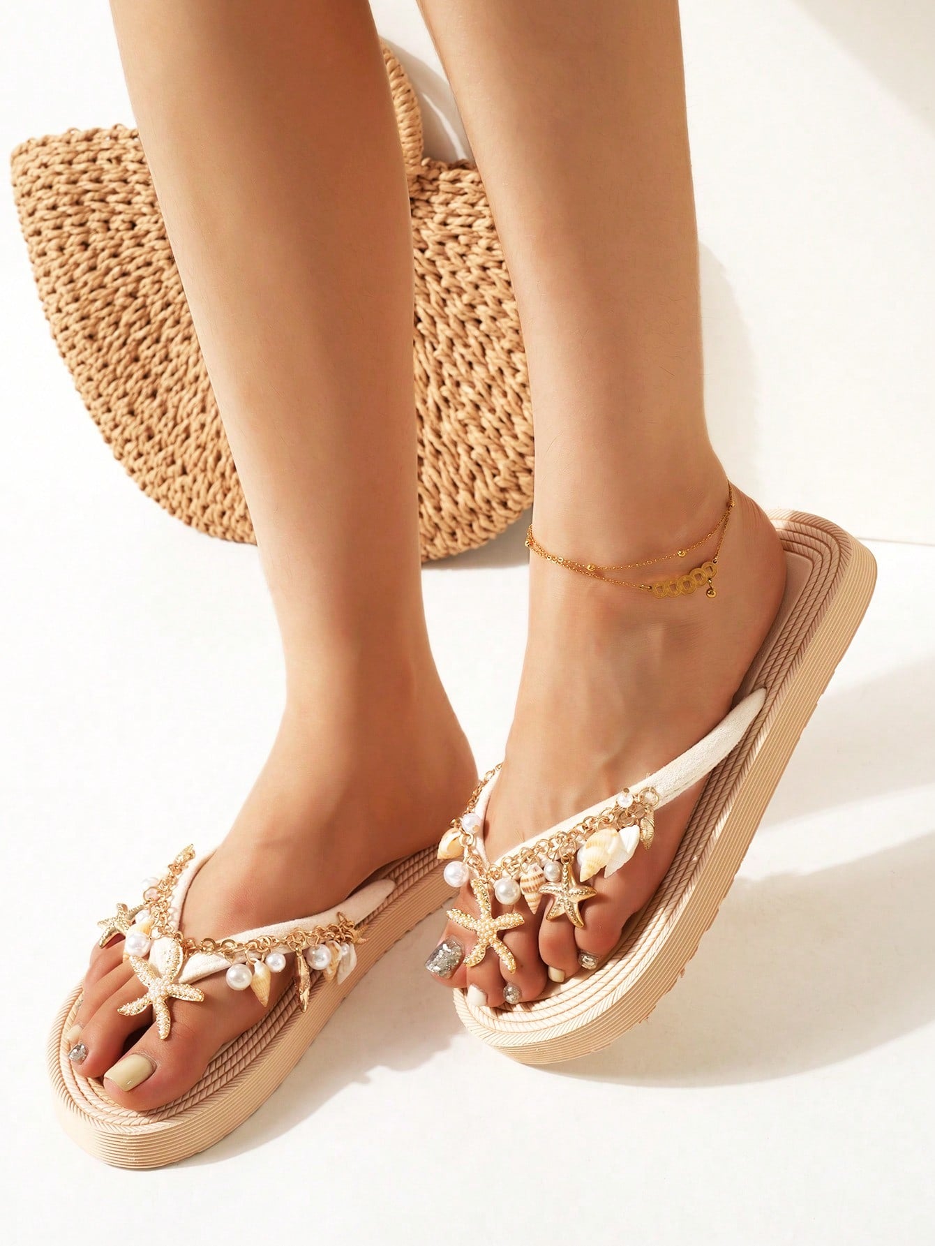 Handmade women’s beach flip flop sandals with shell and starfish rhinestone decorated woven straps, flat thong style, and lightweight non-slip sole.