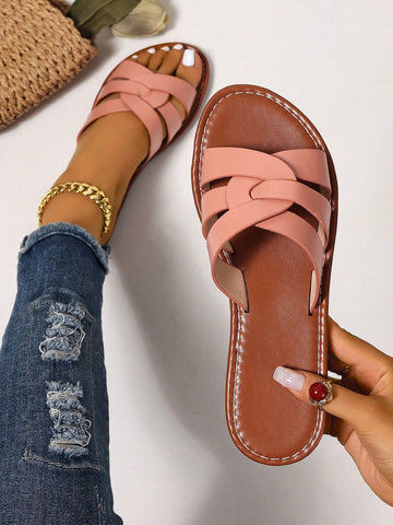 Women’s flat open-toe slide sandals with braided strap detail, embossed texture, and rhinestone decoration, designed as casual slip-on footwear for beach and everyday outdoor wear.