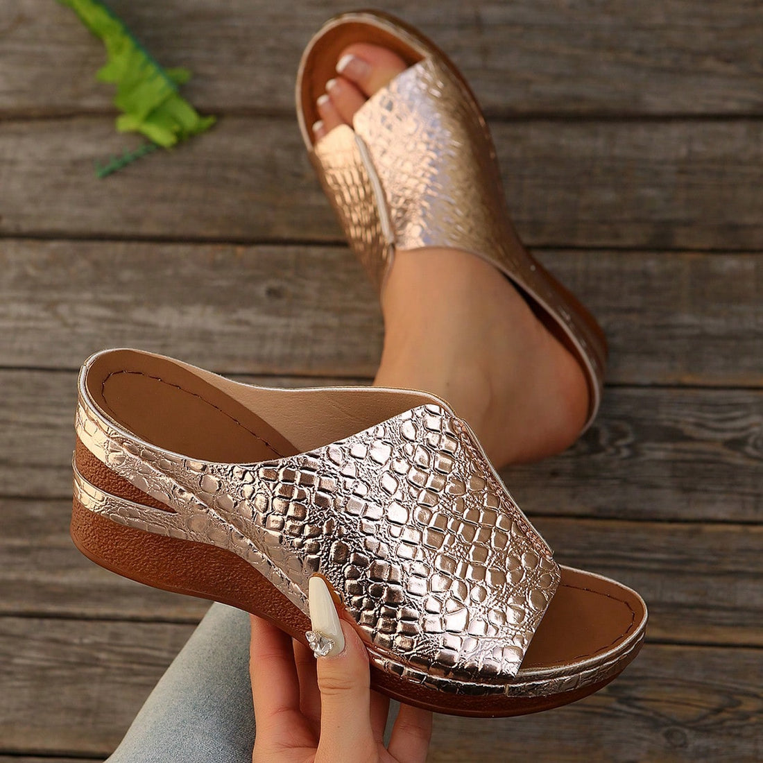 Women’s open-toe wedge slide sandals with hollow-out detail and plain design, one-piece PU leather upper, suitable for outdoor wear.