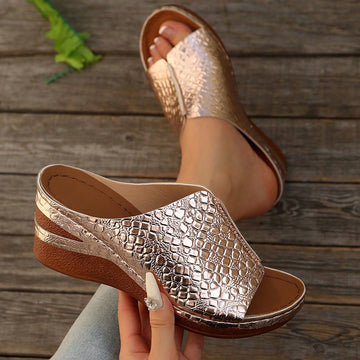 Women’s open-toe wedge slide sandals with hollow-out detail and plain design, one-piece PU leather upper, suitable for outdoor wear.