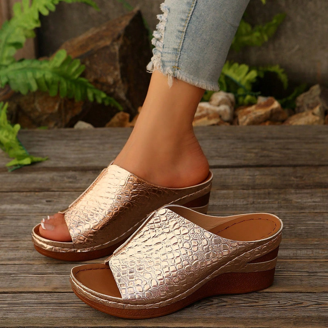 Women’s open-toe wedge slide sandals with hollow-out detail and plain design, one-piece PU leather upper, suitable for outdoor wear.