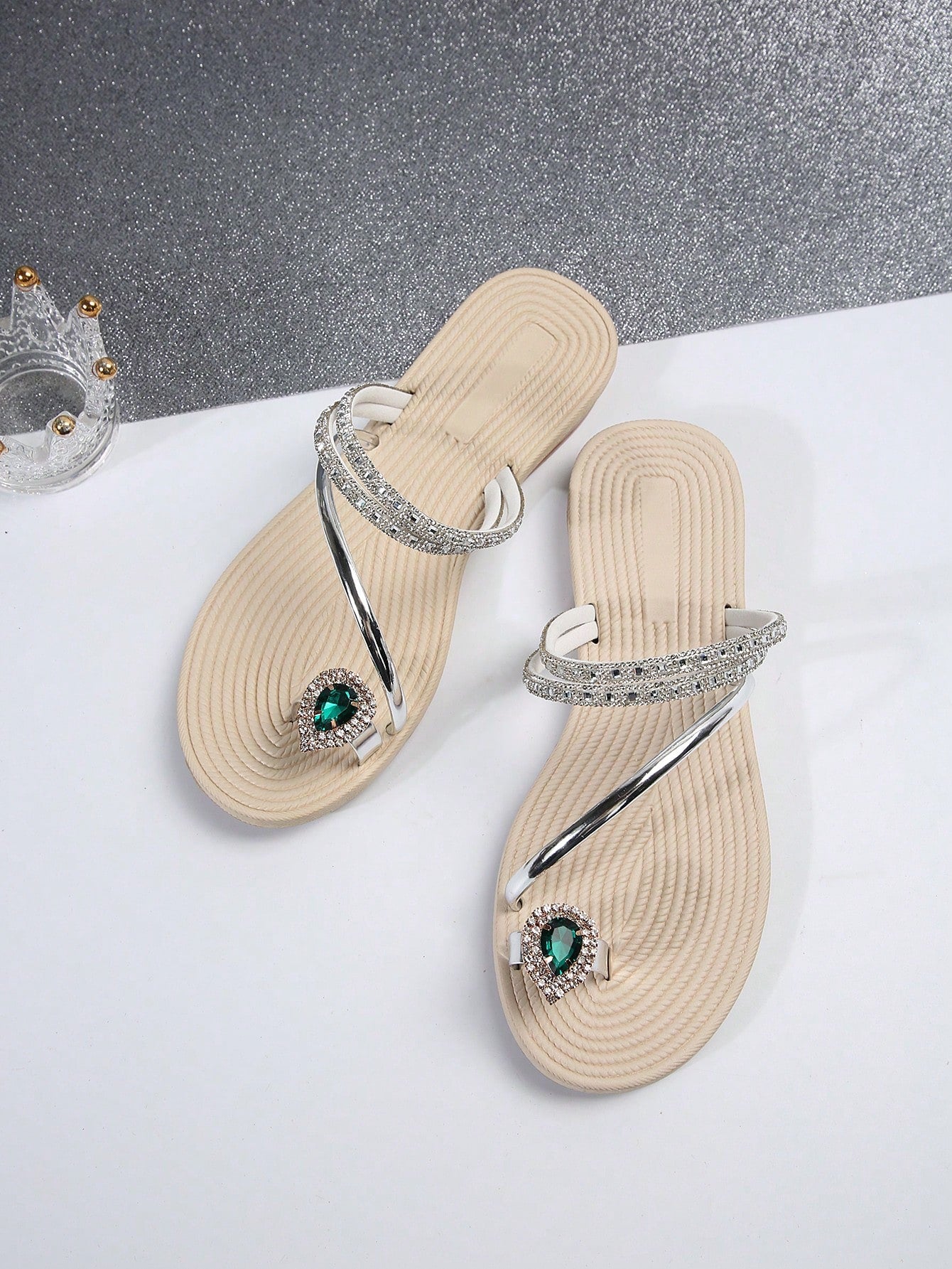 Women's flat slide sandals with crystal-style rhinestone and bow embellishments, toe post front, and beach-ready slip-on design.
