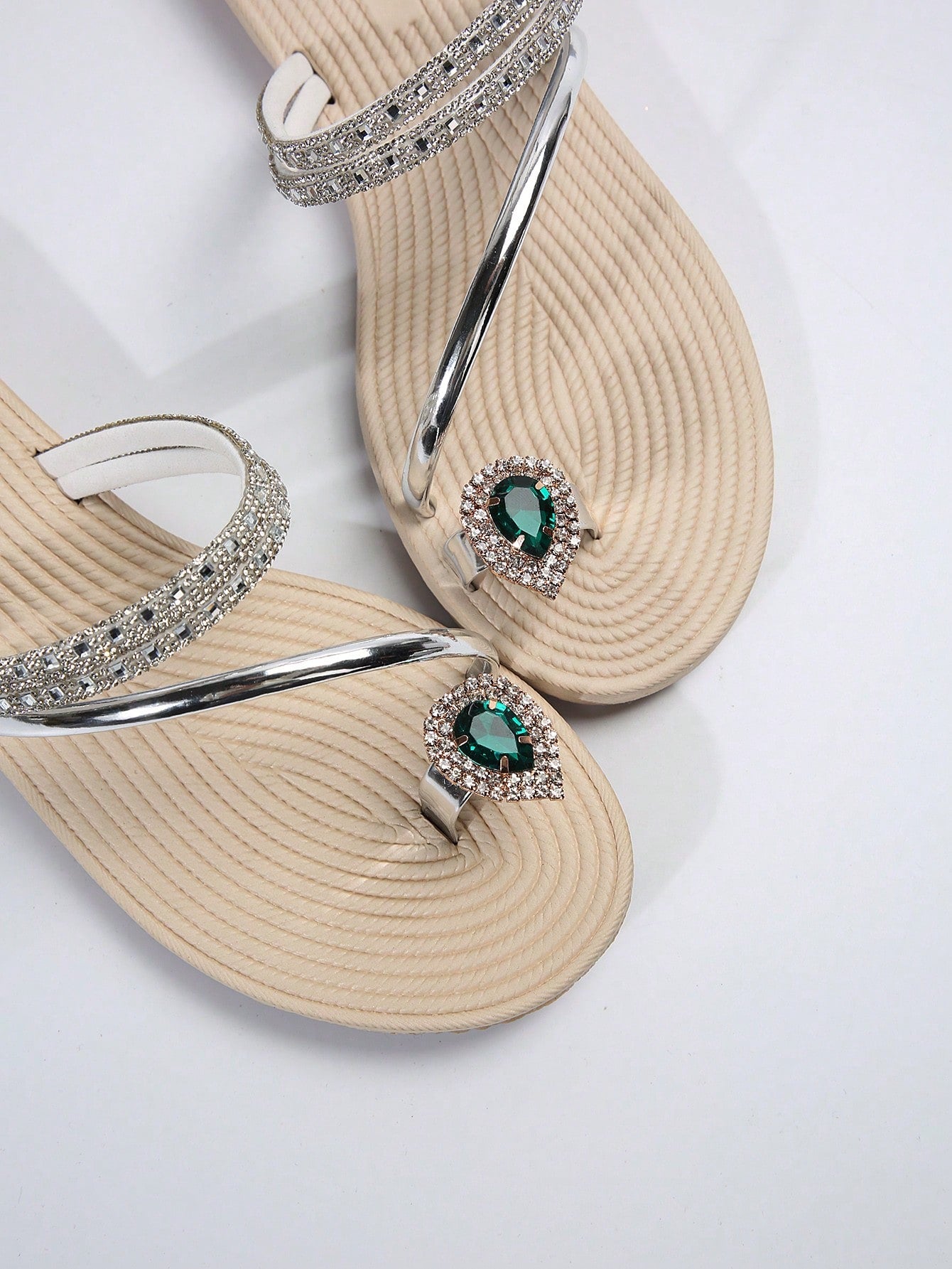 Women's flat slide sandals with crystal-style rhinestone and bow embellishments, toe post front, and beach-ready slip-on design.