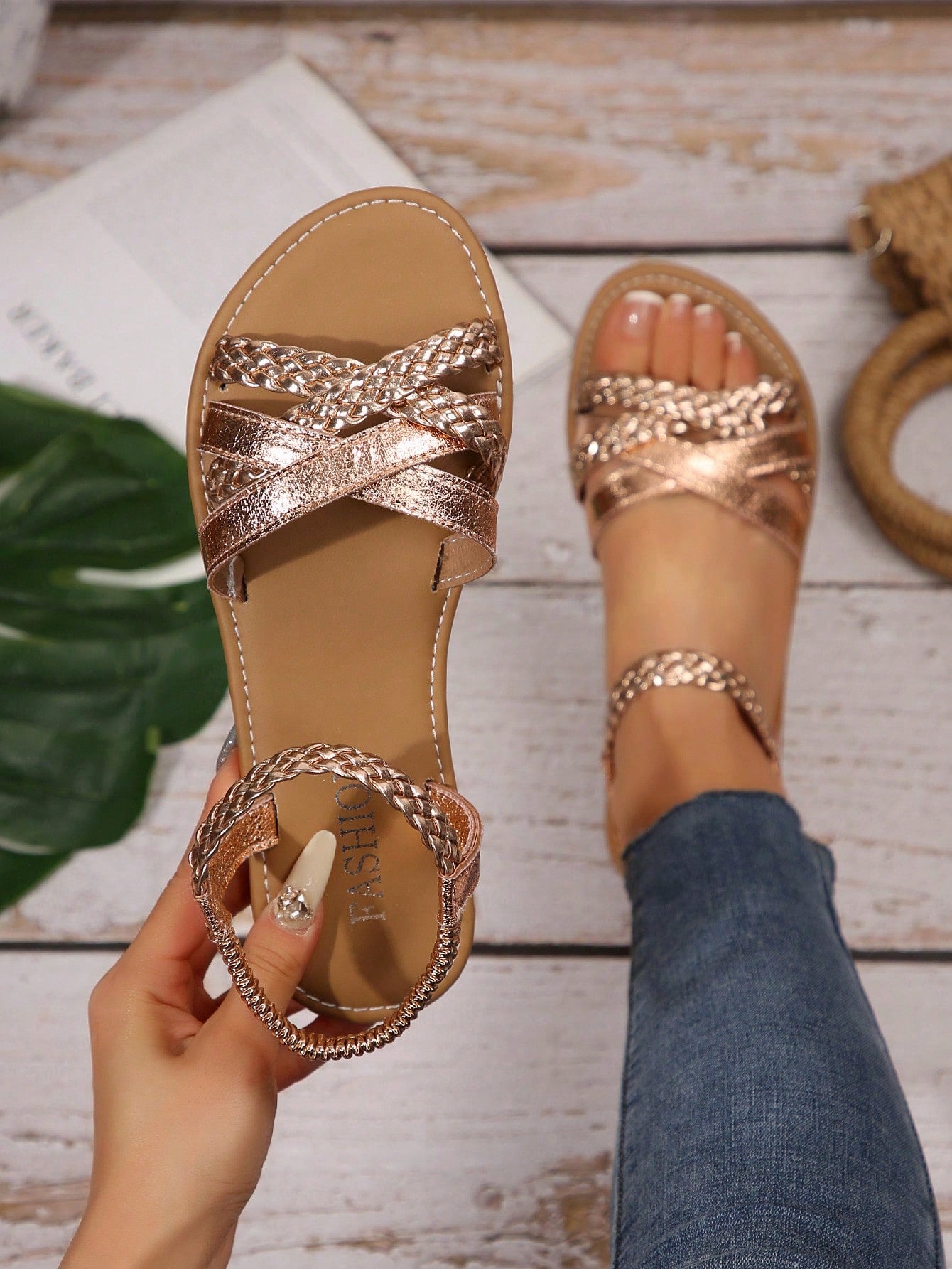 Women’s flat slide sandals with criss-cross straps, open toe, and braid detail, designed for lightweight casual and beach wear.