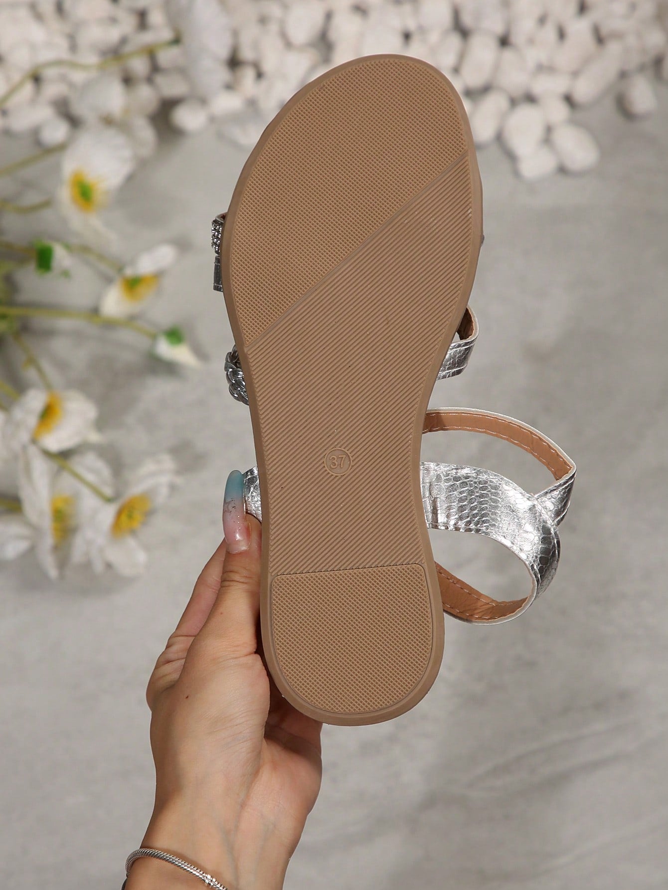 Women’s flat gladiator sandals with handwoven-style criss-cross rhinestone straps and open-toe design