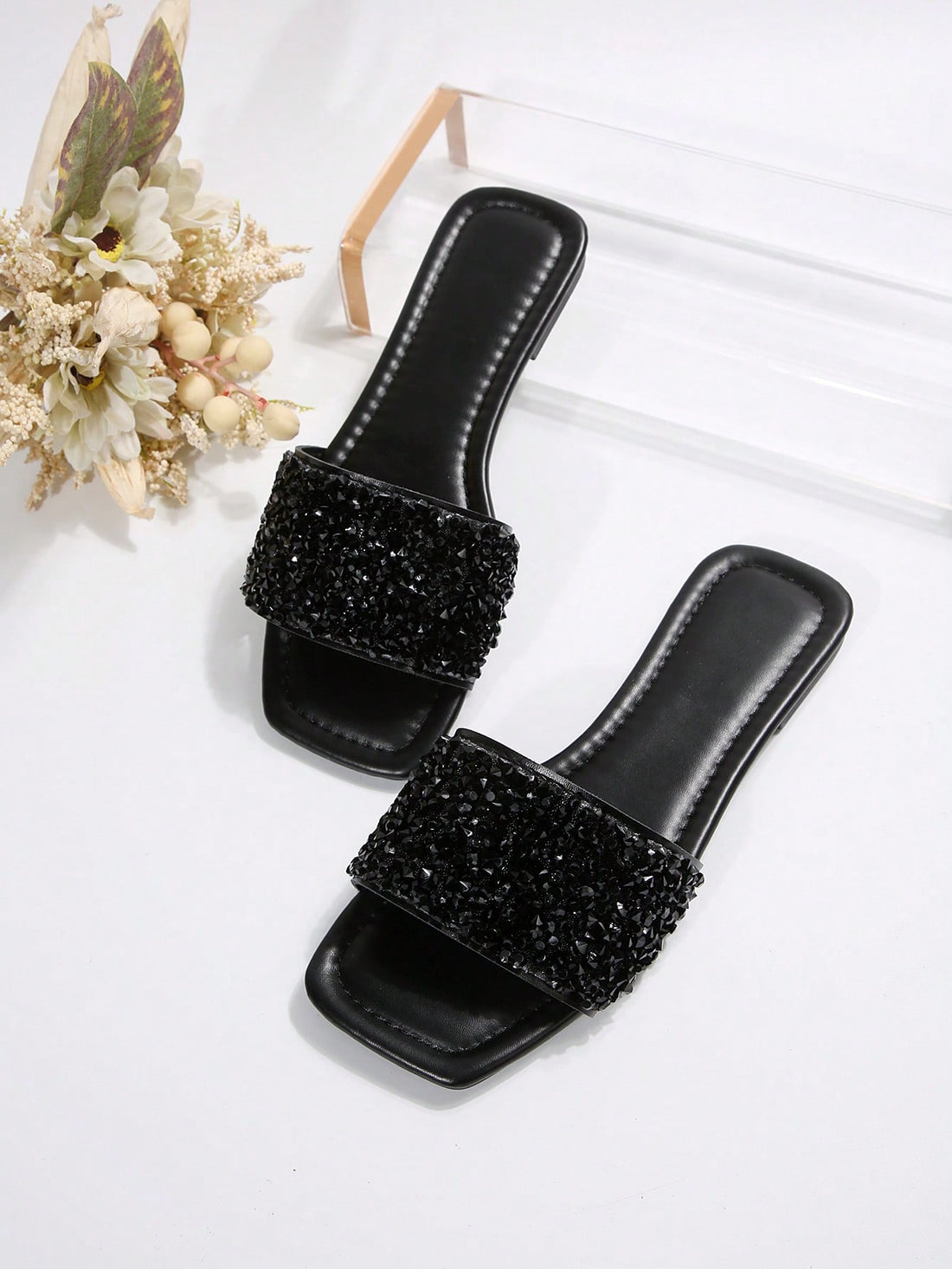 Women's flat slide sandals with rhinestone-decorated straps and open toe, casual outdoor style with plain design.
