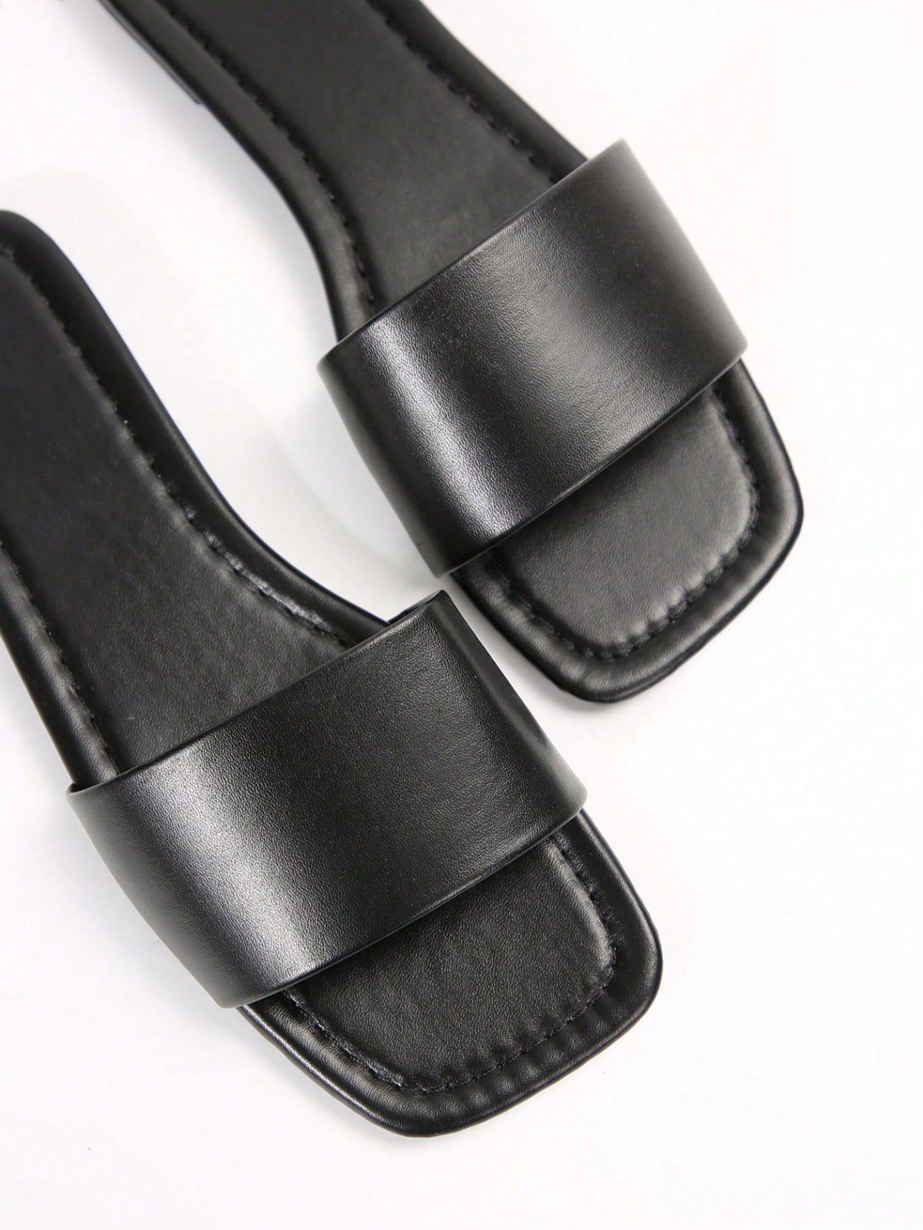 Women's flat slide sandals with a minimalist strap design, square open toe, and slip-on style for casual indoor and outdoor wear.