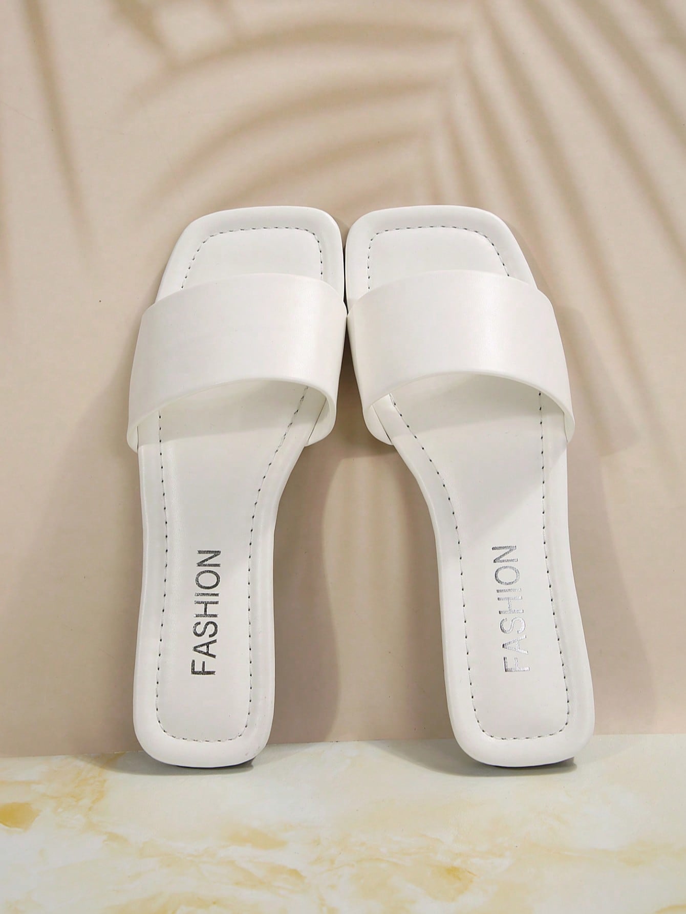 Women's flat slide sandals with a minimalist strap design, square open toe, and slip-on style for casual indoor and outdoor wear.
