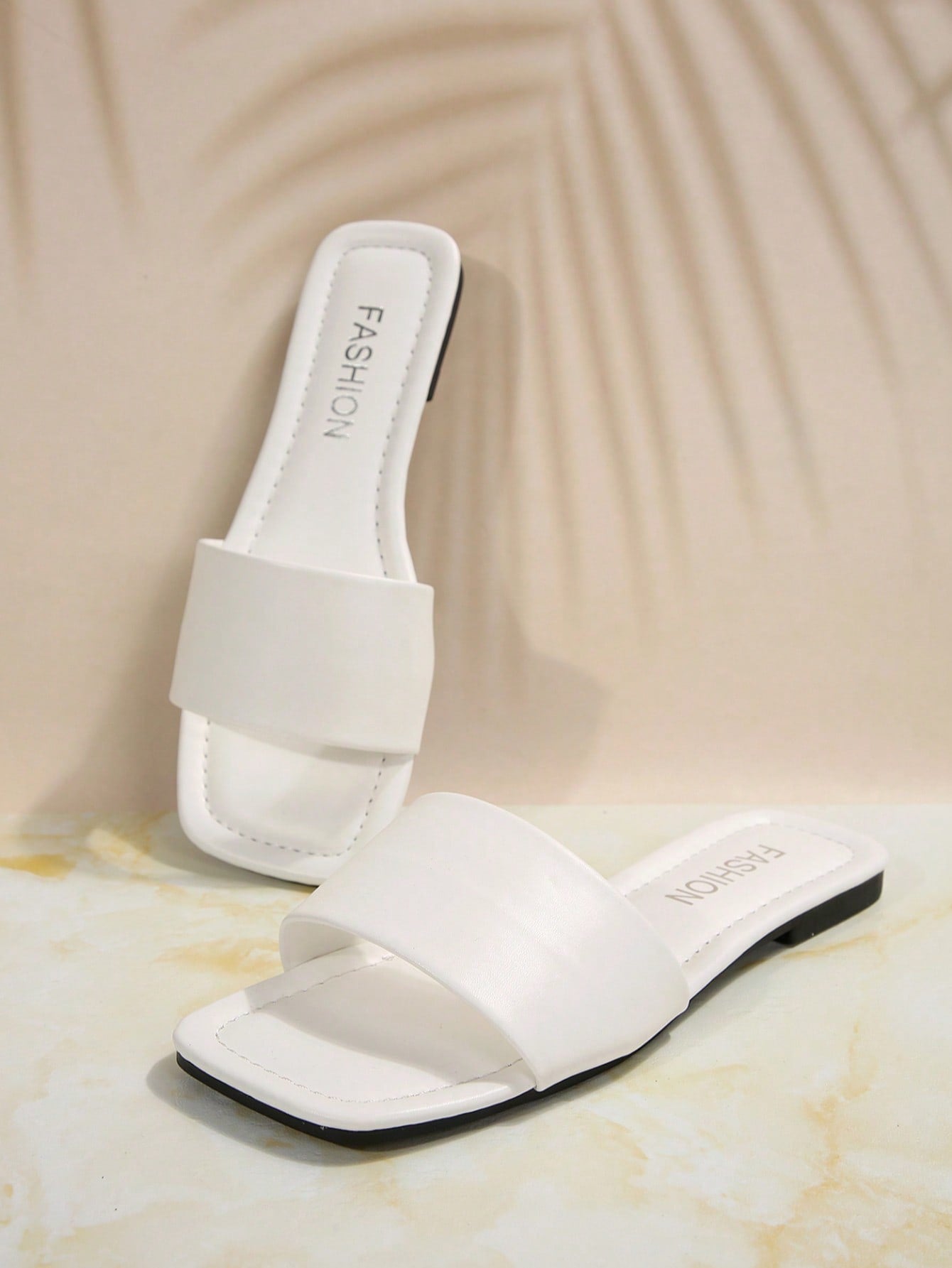 Women's flat slide sandals with a minimalist strap design, square open toe, and slip-on style for casual indoor and outdoor wear.