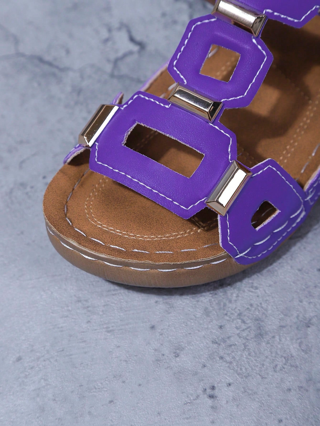 Women's open-toe wedge slide sandals with studded hollow-out upper, cross-over straps, buckle closure, and thick soft sole