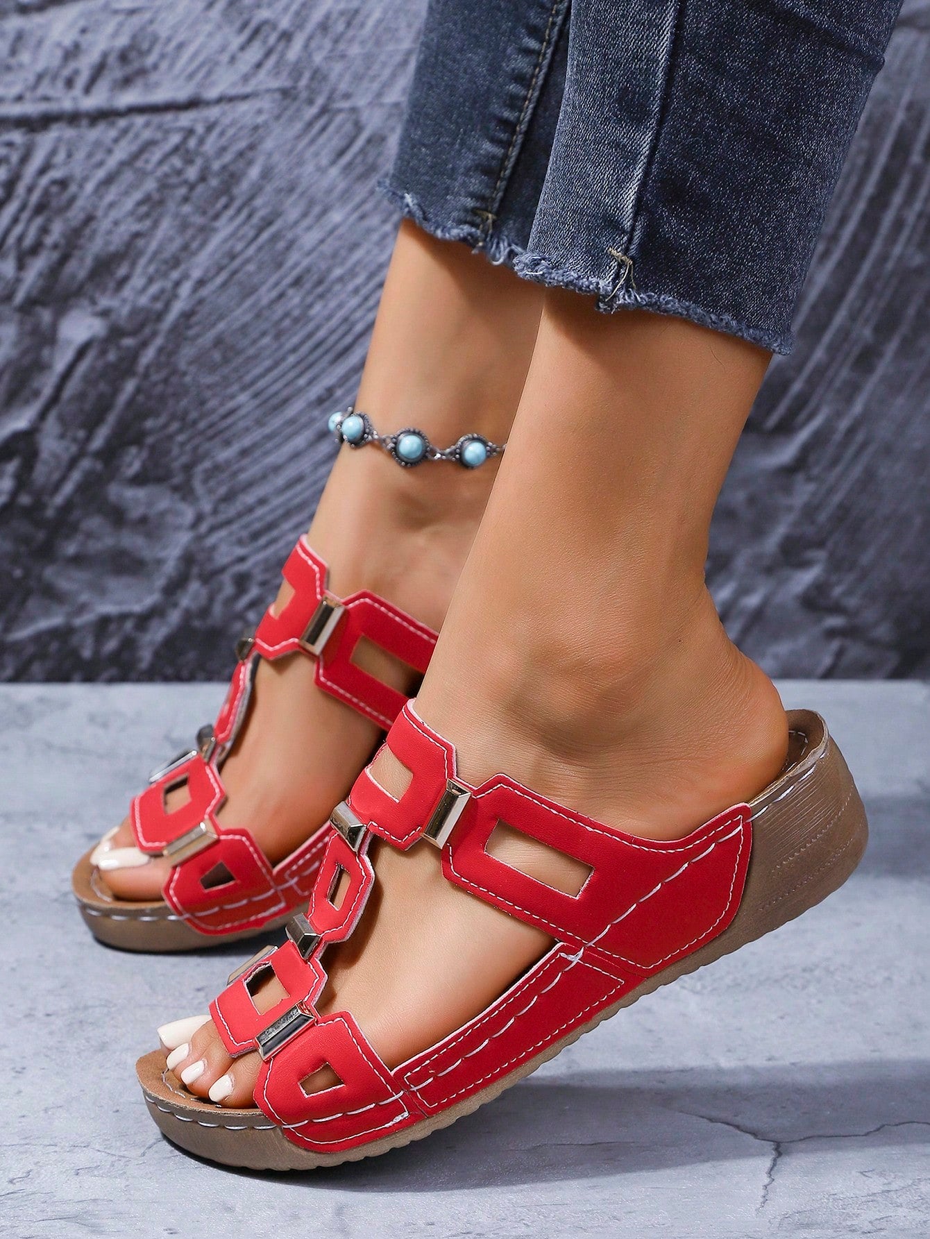 Women's open-toe wedge slide sandals with studded hollow-out upper, cross-over straps, buckle closure, and thick soft sole