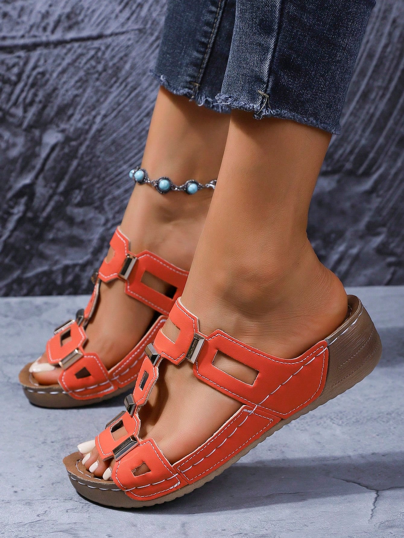 Women's open-toe wedge slide sandals with studded hollow-out upper, cross-over straps, buckle closure, and thick soft sole